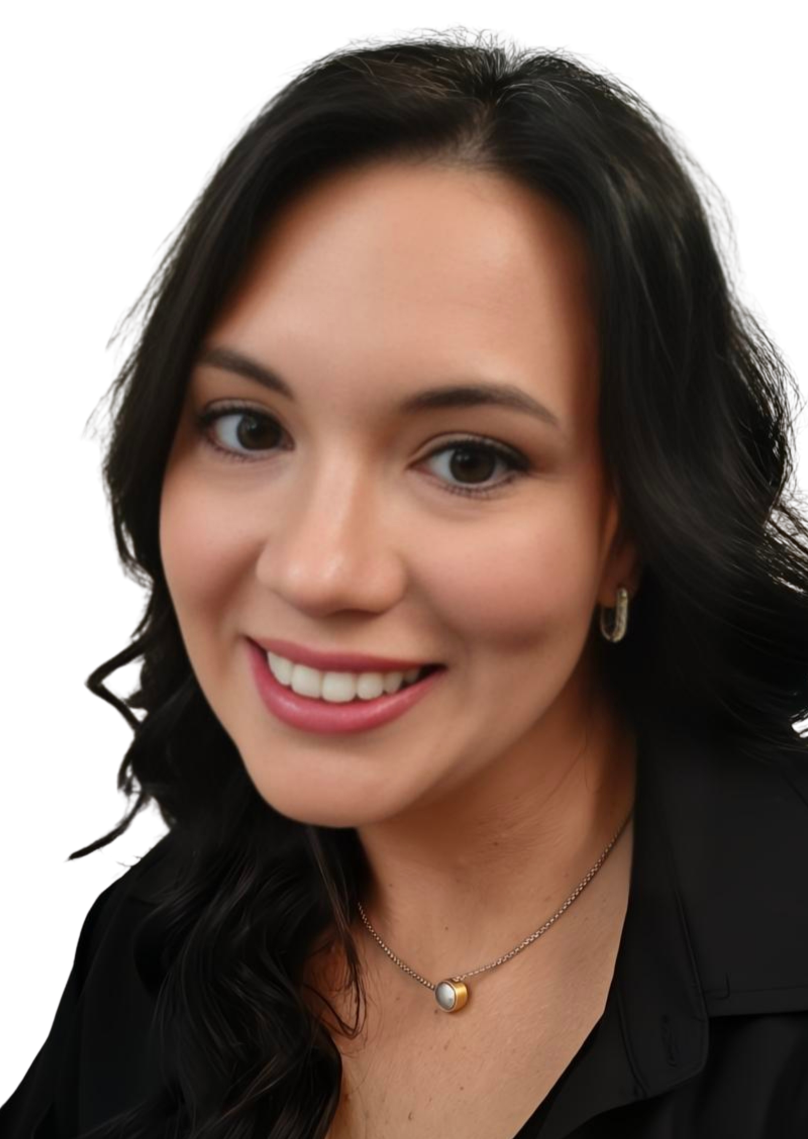 Close-up of the spray tan artist who owns sunfield spray tans and is a smiling woman with dark, wavy hair wearing a black top, hoop earrings, and a necklace with a round pendant, against a plain white background.