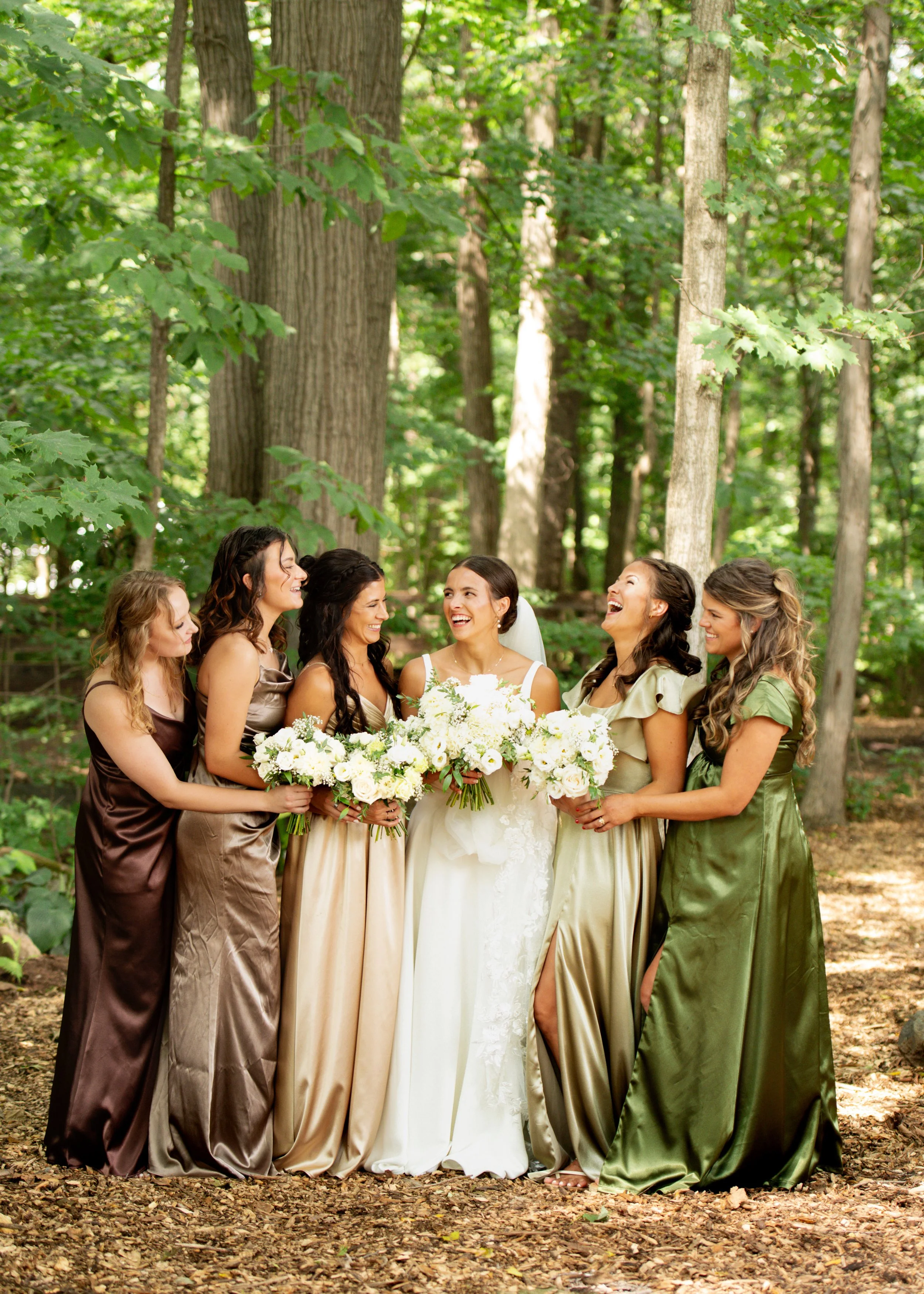 Bridesmaids in shimmering earth tone dresses