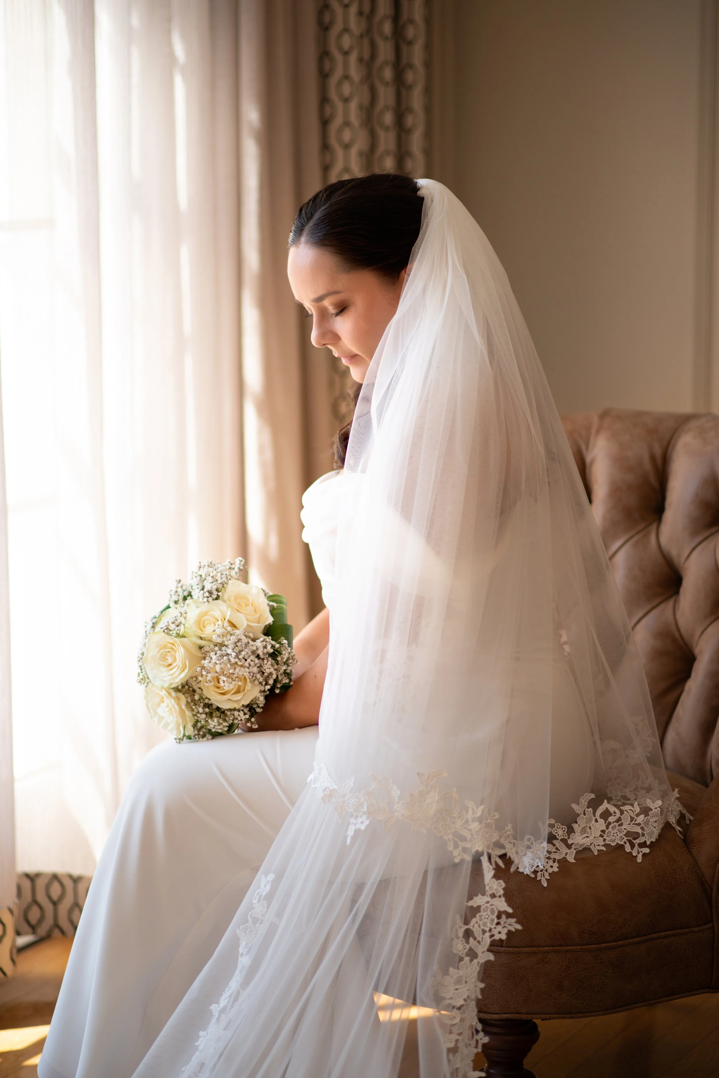 Elegant Bride with classic cathedral veil.