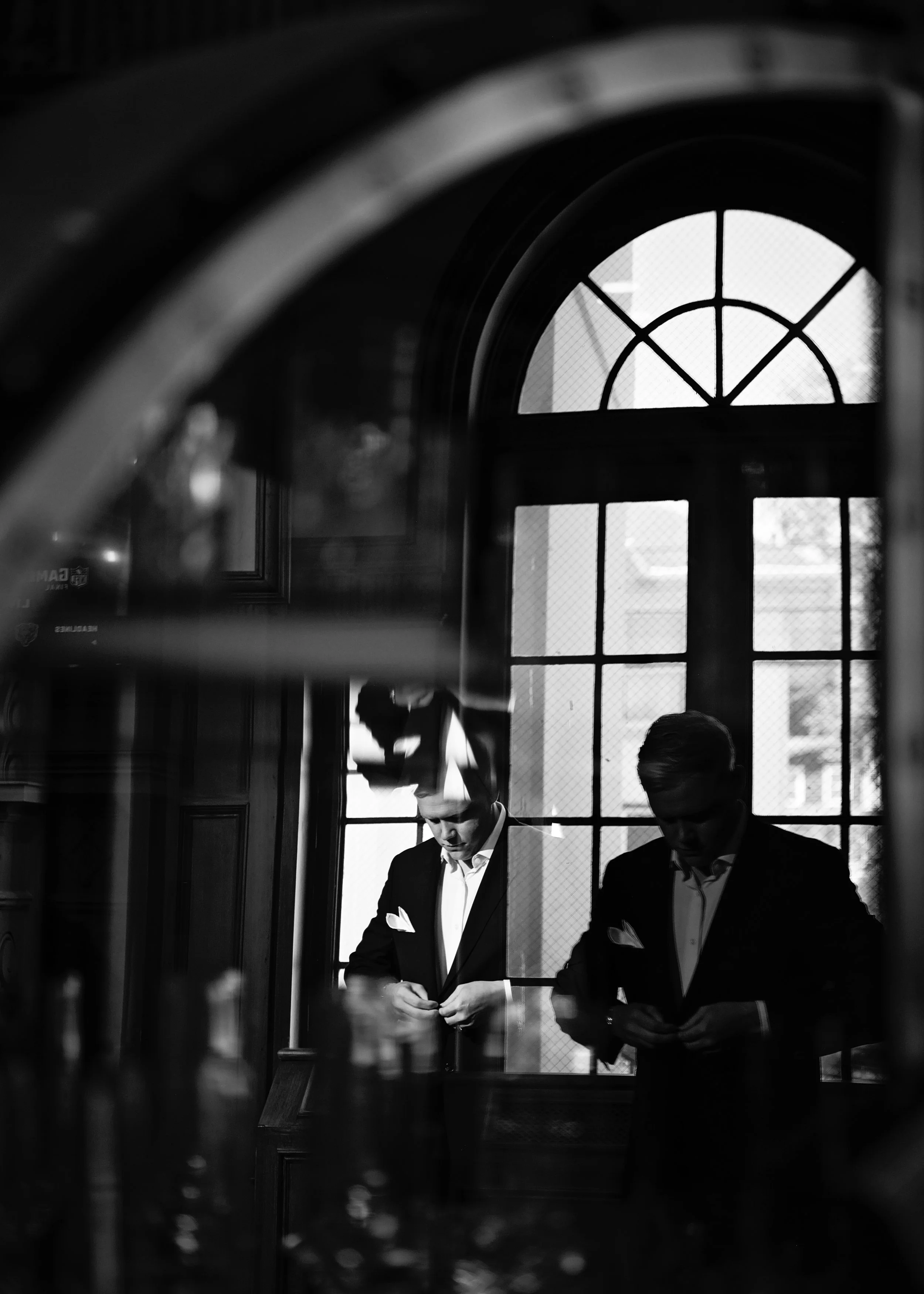 Modern Black and White Groom Reflection in Mirror Photo.