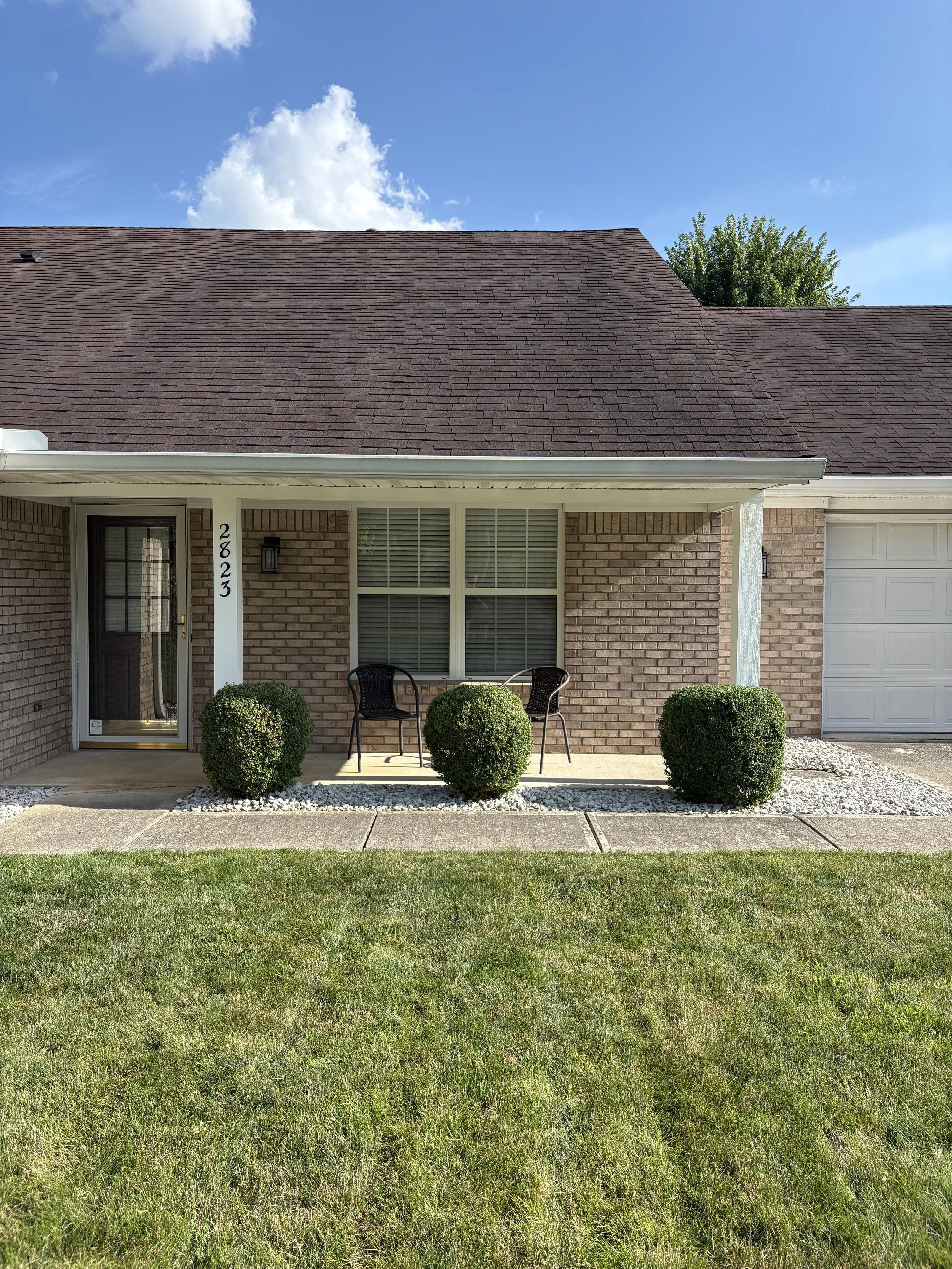 Hedge trimming and lawn care services in Richmond Indiana with clean, maintained shrubs by Maintenance Bros