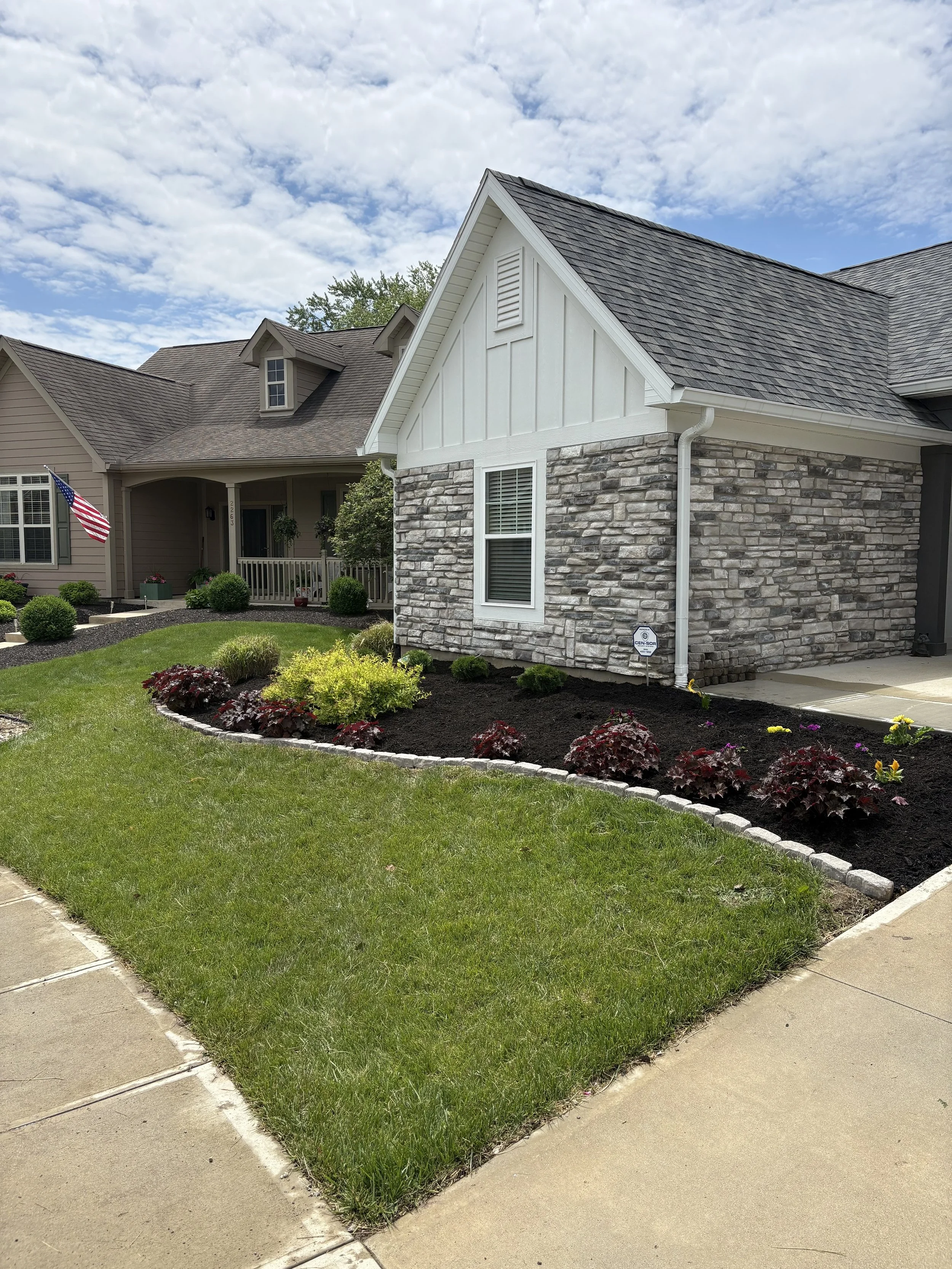 Front yard landscaping and mulch installation in Richmond Indiana by Maintenance Bros lawn care team