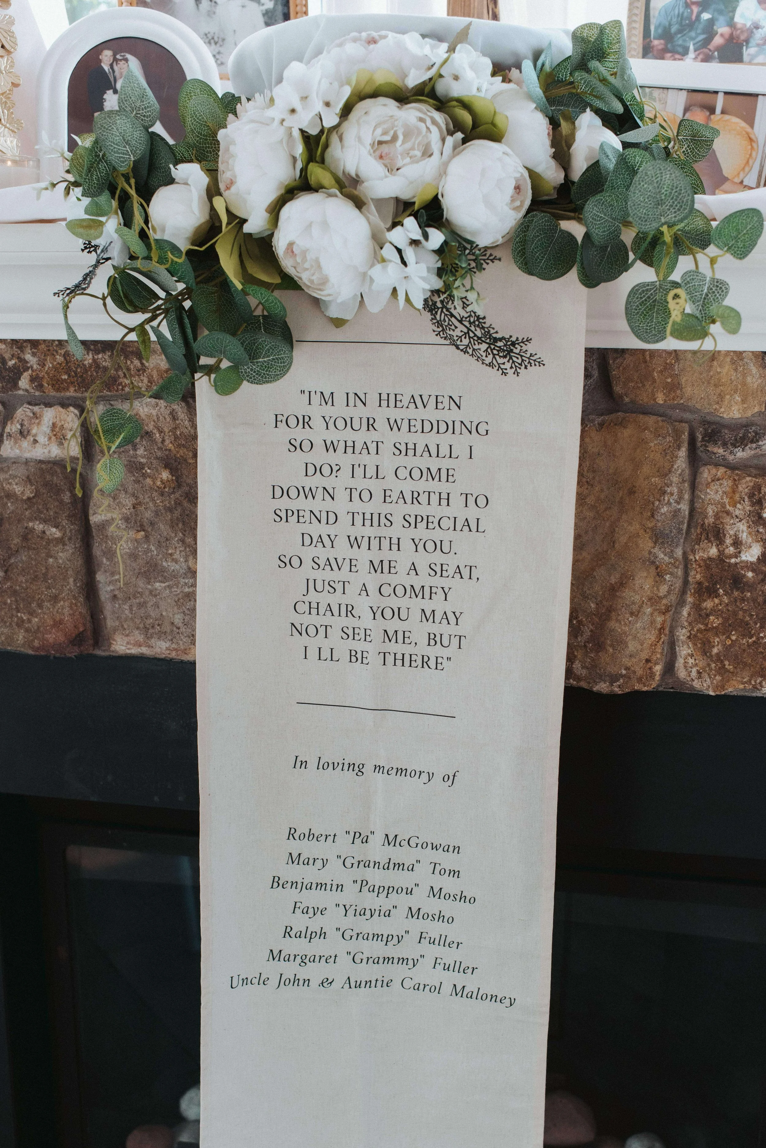 Lush floral arrangement with white peonies and greens resting on memorial banner, Kennebunkport Maine, florals by Milkweed Floral Co