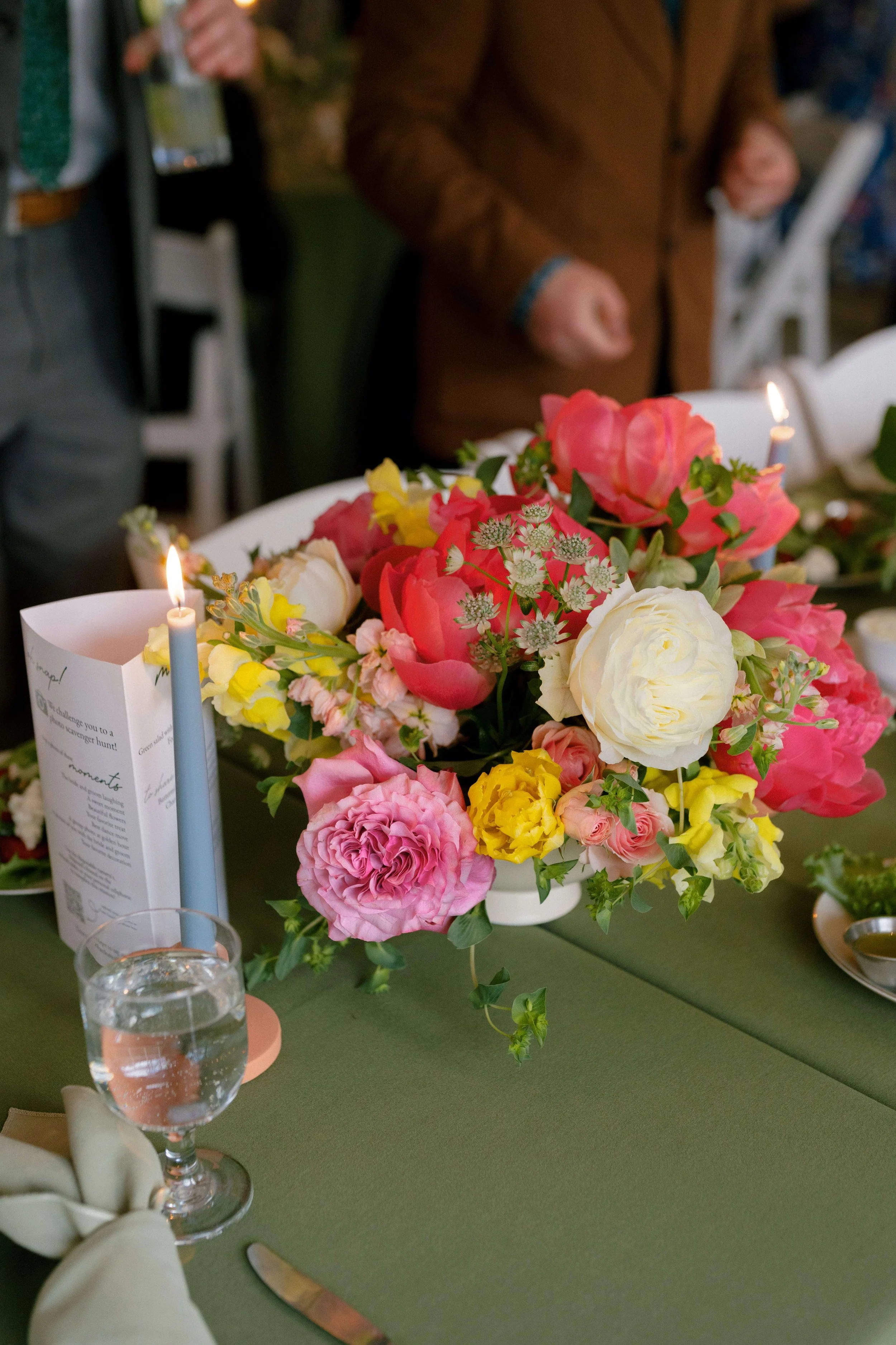 Vibrant spring centerpiece with coral peonies, pink roses, and yellow snapdragons on sage green linen, Montague Massachusetts, Milkweed Floral Co