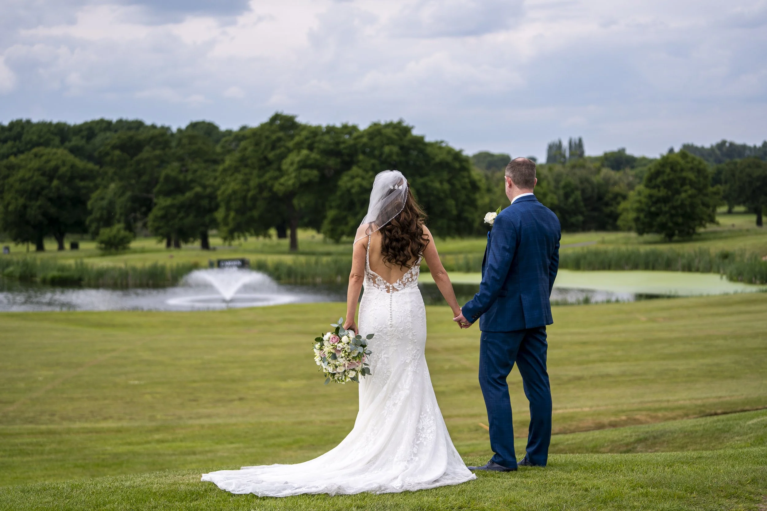 carden park hotel wedding photography cheshire wedding photographers couple outside in grounds golf course