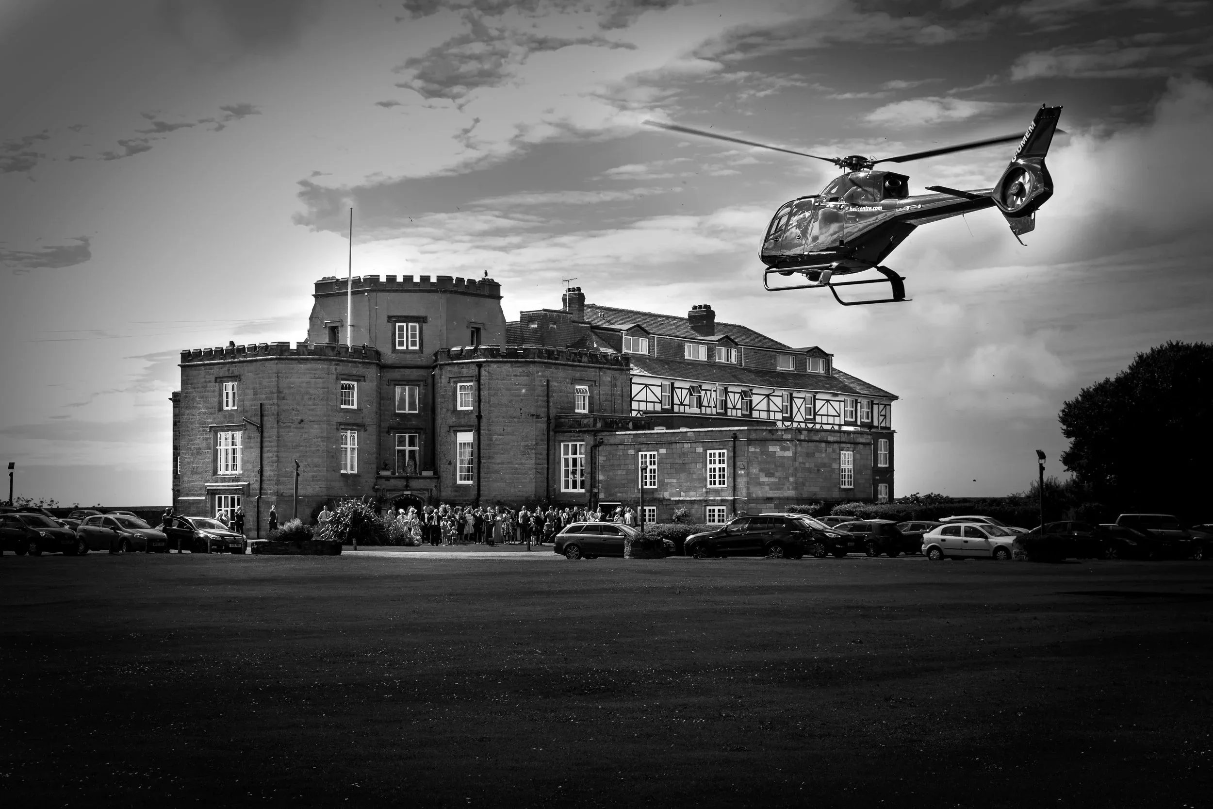 bride and groom arrive by helicopter at Leasowe Castle, the exclusive wedding venue in the Wirral