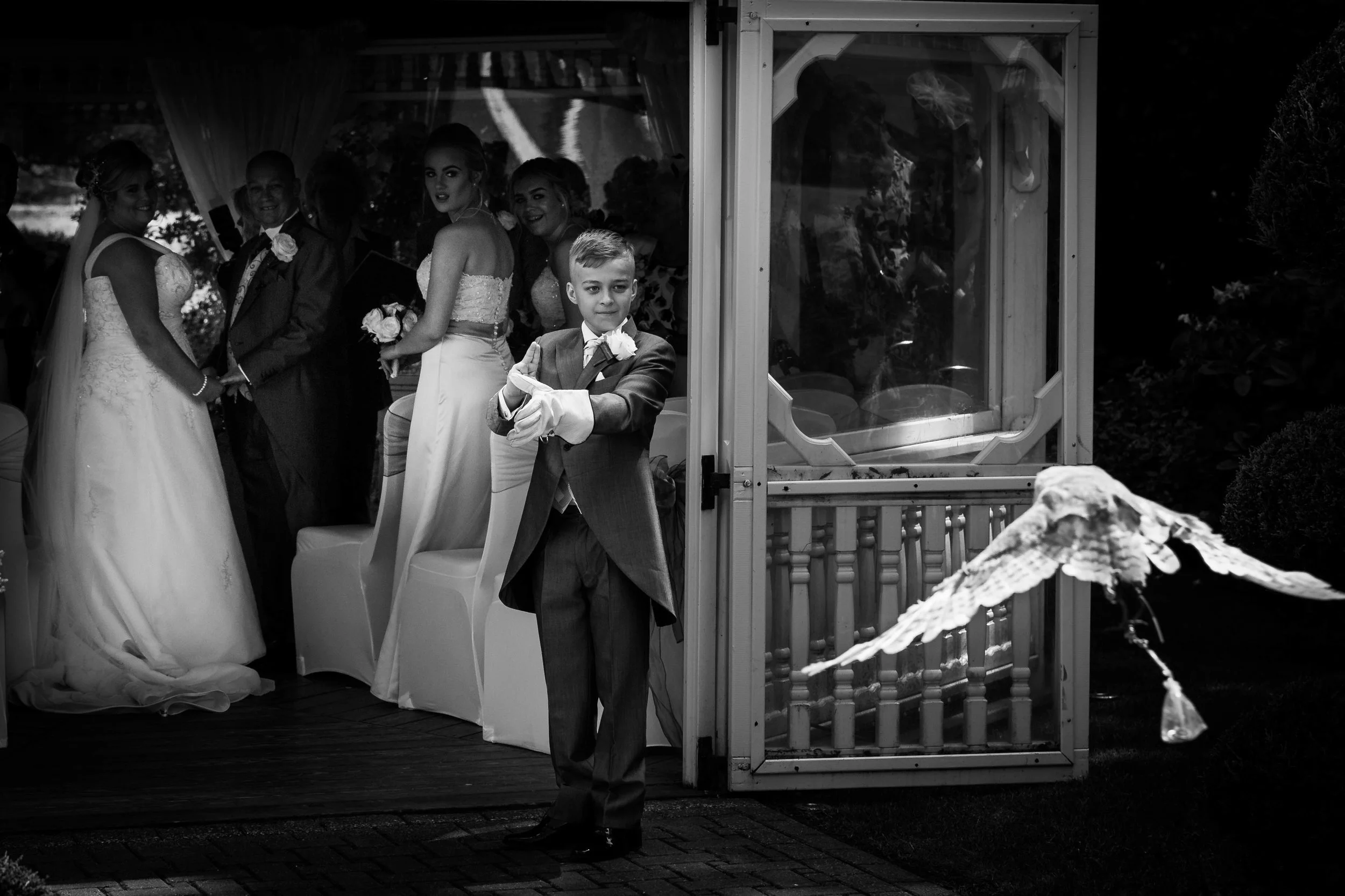 Thornton Hall Hotel and Spa wedding photography outside summer with an owl carrying the rings