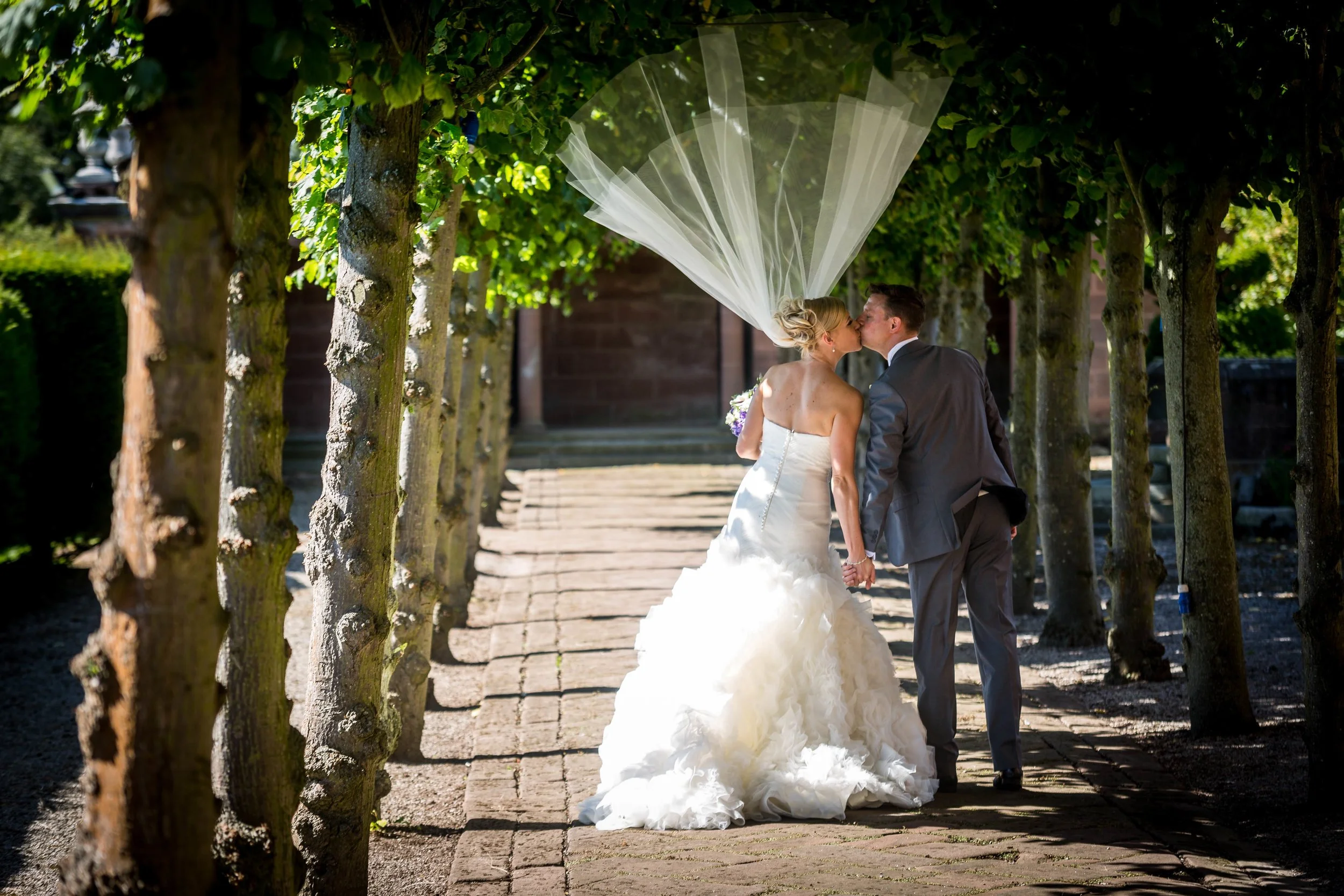 Thornton manor house hotel wedding photography wirral limewalk veil in the air from wind