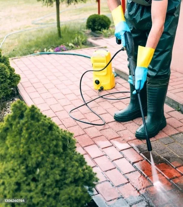 man power washing floor