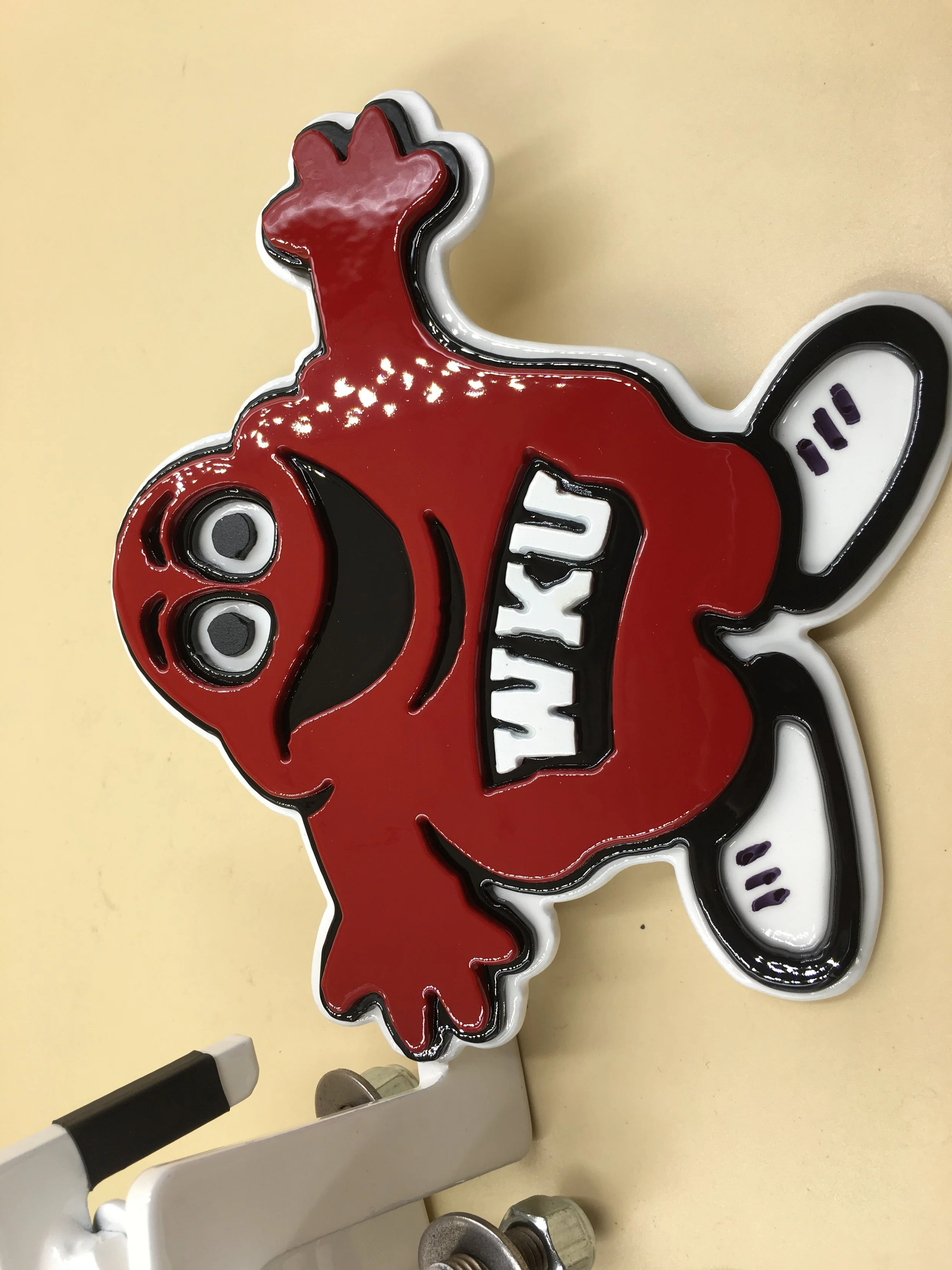 Red and black skateboard deck with a cartoon character design featuring a smiling face and the words "Thank You!" in white. The board has white wheels and is mounted on a white skateboard truck.