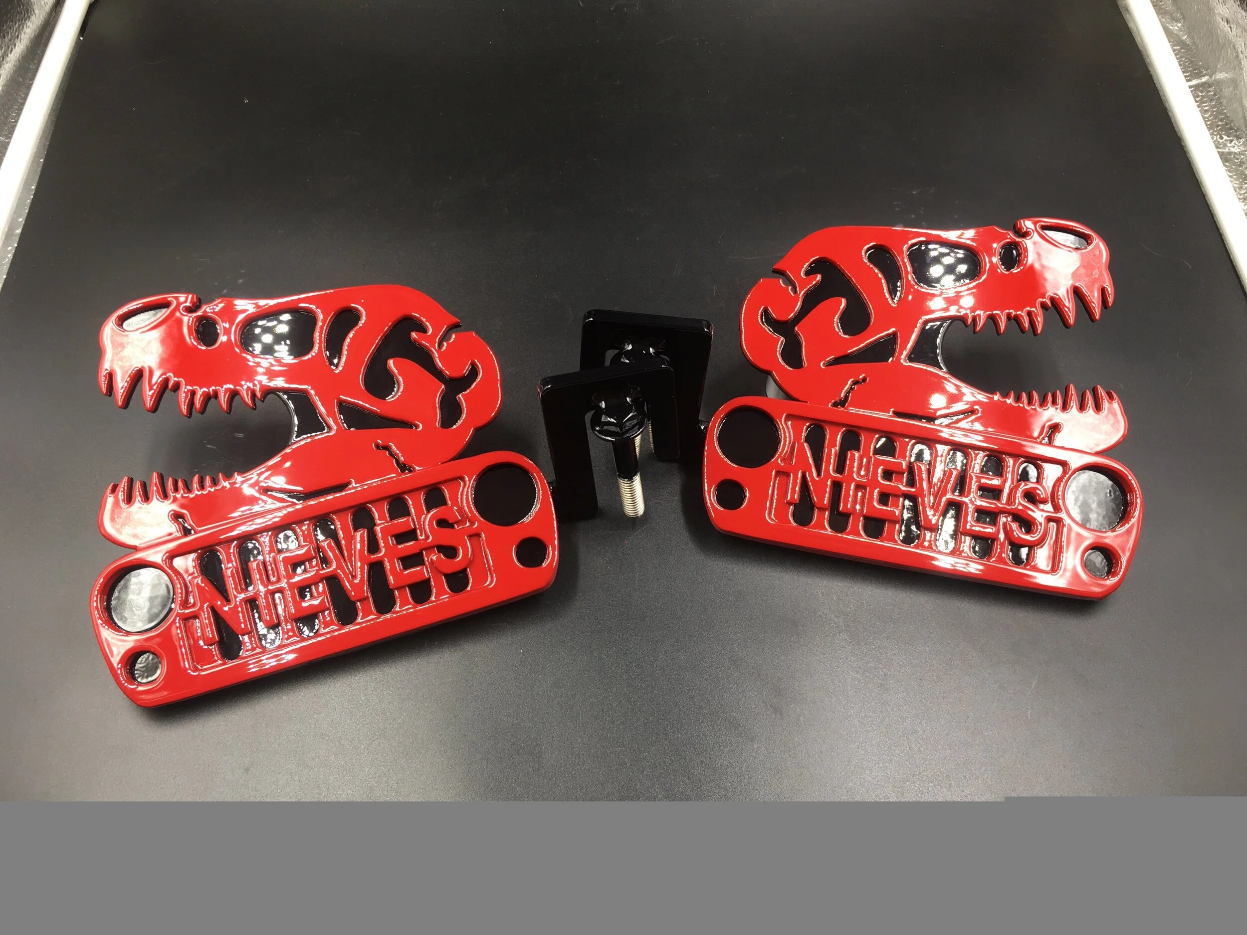 Bold Red Jeep Foot Pegs with Unique Skeletal Design