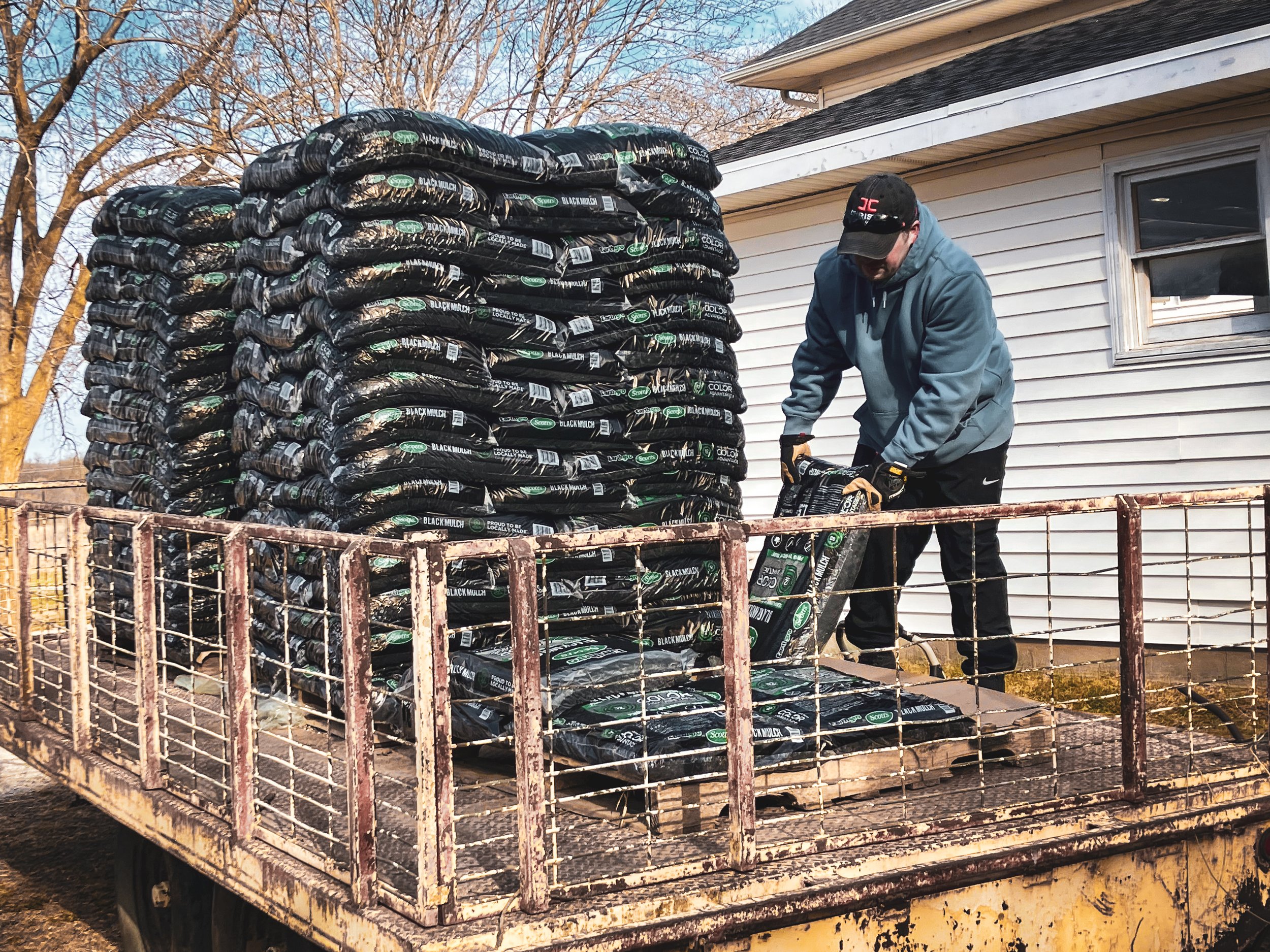 Owner Jon, moving mountains of mulch bags for his Momma