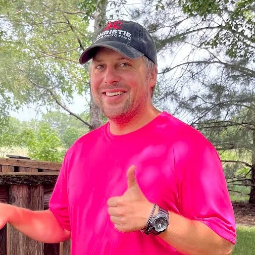 Jonathan Christie in his pink shirt give you a thumbs up while on the job