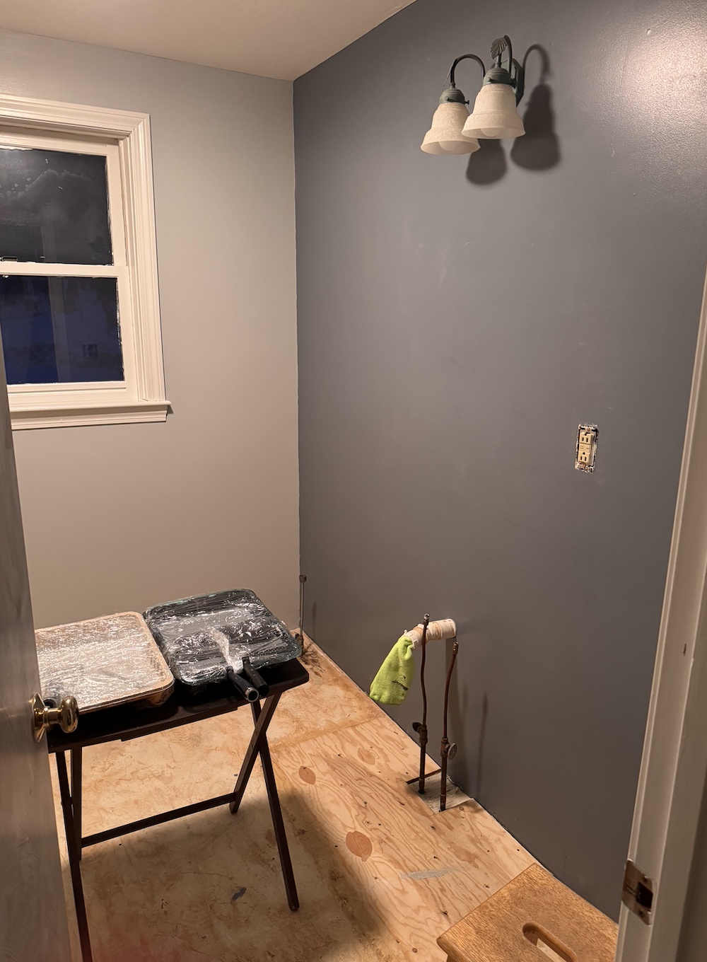 We painted the accent wall, where we will eventually install horizontal shiplap boards. We also ripped up the old vinyl sheet flooring. Super satisfying!