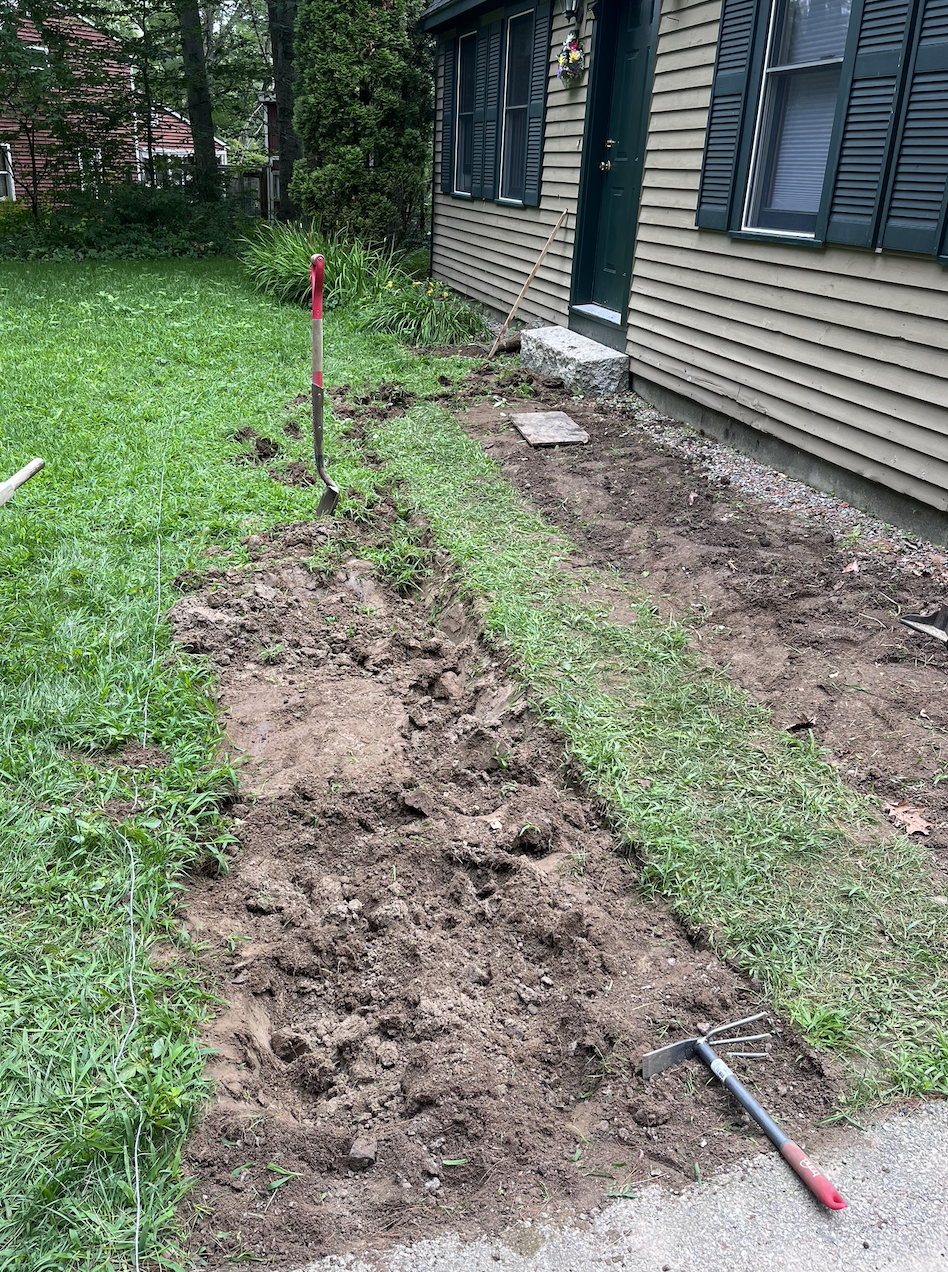 Breaking up the grass to mark out the walkway.
