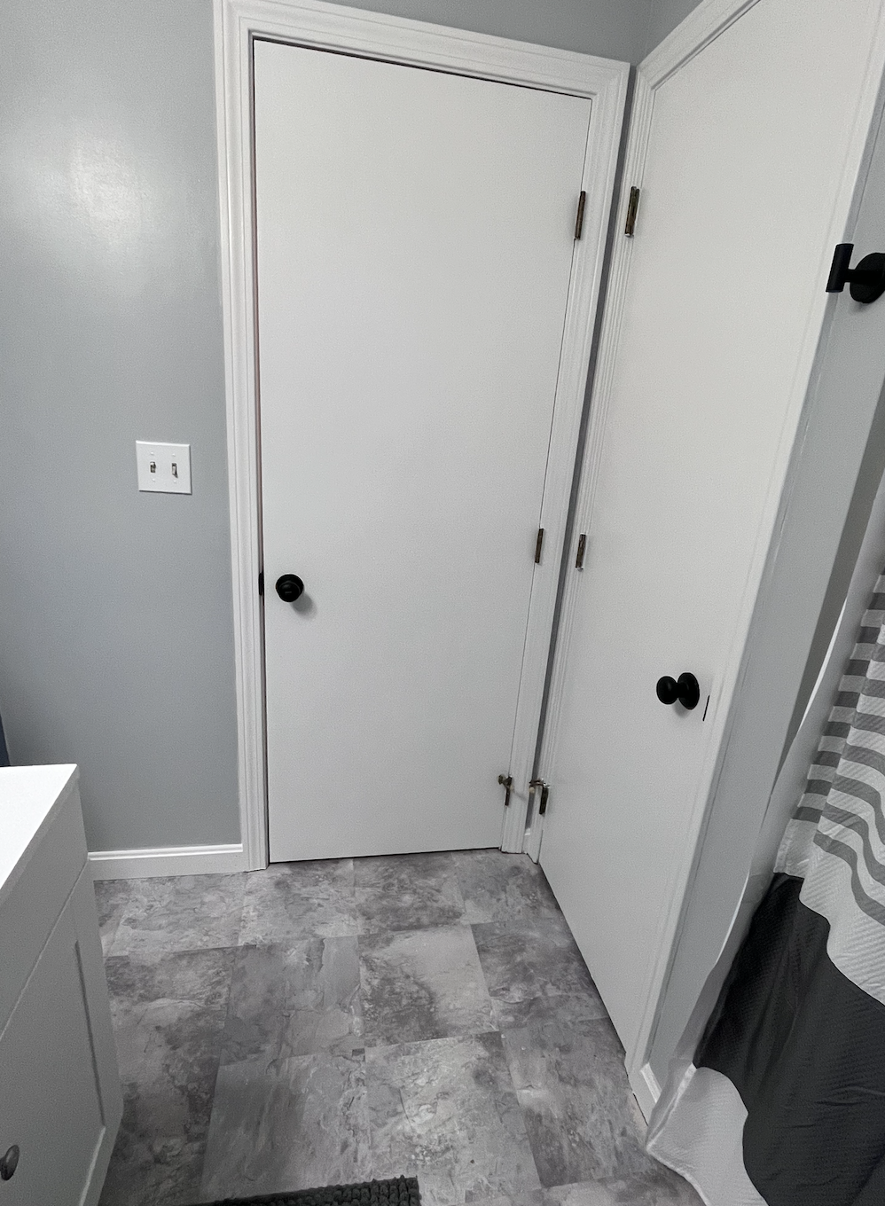 Finished the trim, the doors and installed new black door knobs and accessories. We have since changed up all of the hinges as well. Complete!