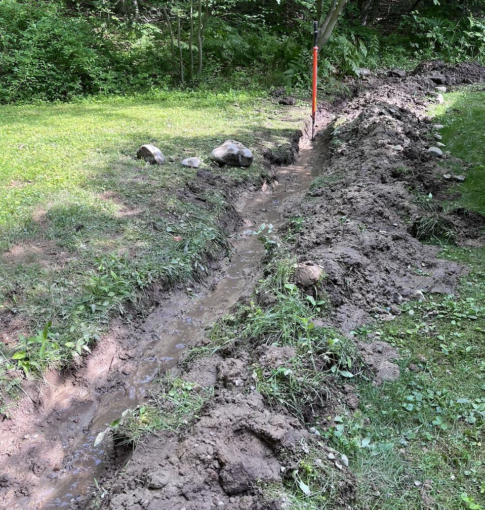 Continued the trench upward, encountered decent size rocks. As my dad paraphrased from Archimedes, "With a big enough lever, you can move the world!"