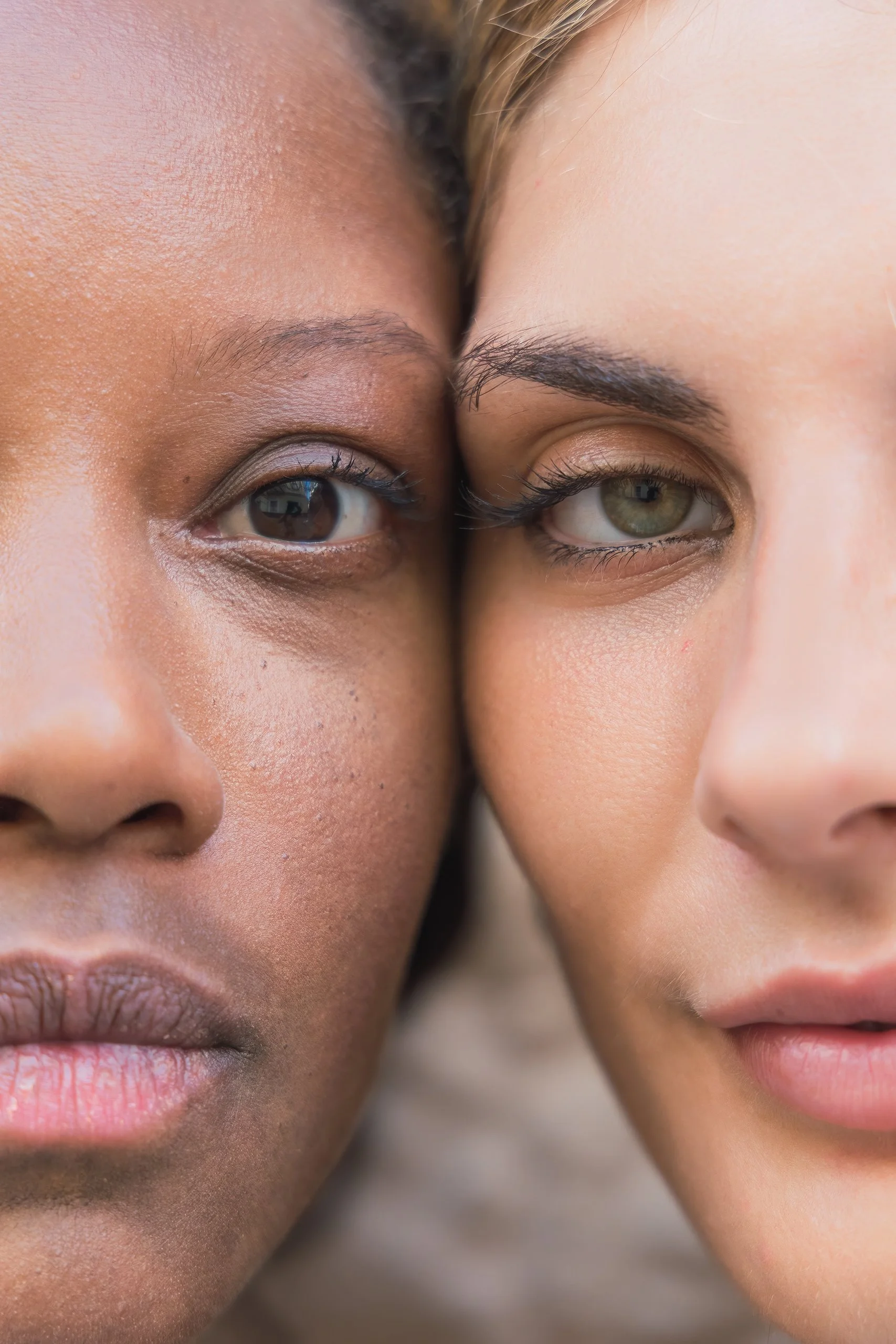 close up of two women's faces who are calm and contemplative