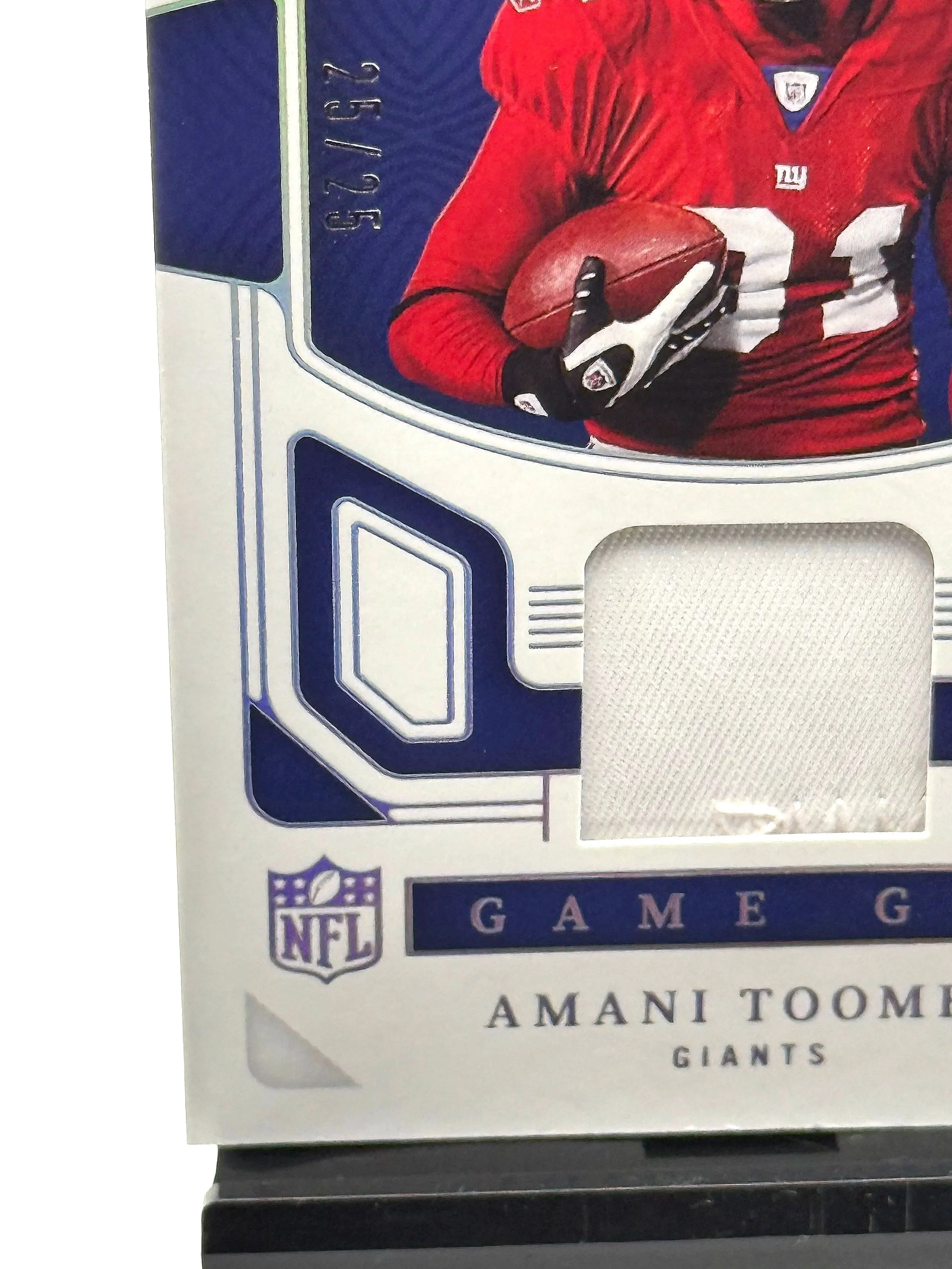 2022 National Treasures Amani Toomer Game Gear Game-Worn Patch /25 #GTE-ATO football card bottom left corner