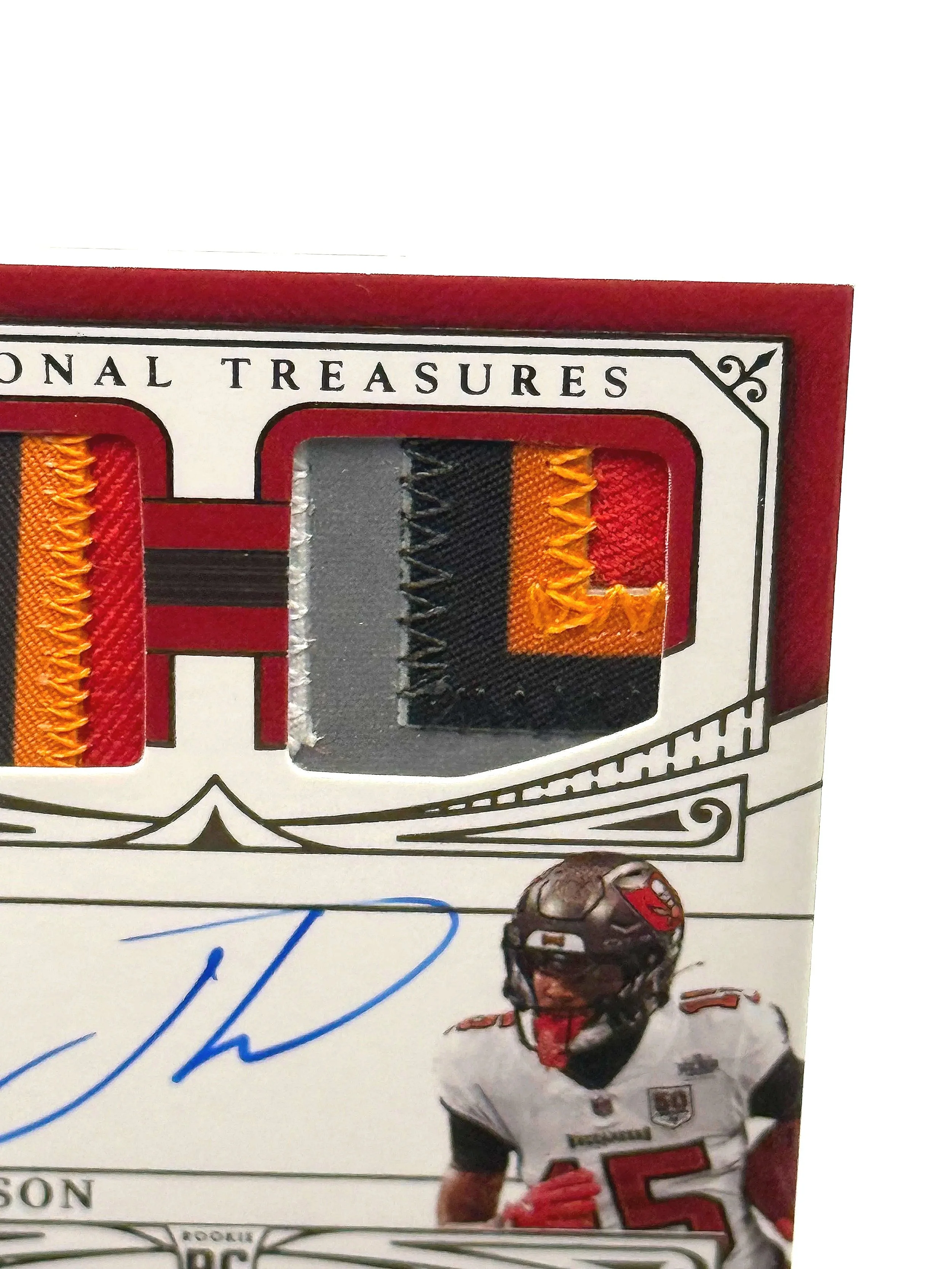 2025 Panini National Treasures – Tez Johnson Rookie Materials Auto Quad Patch #RMAQ-TJN football card top right corner