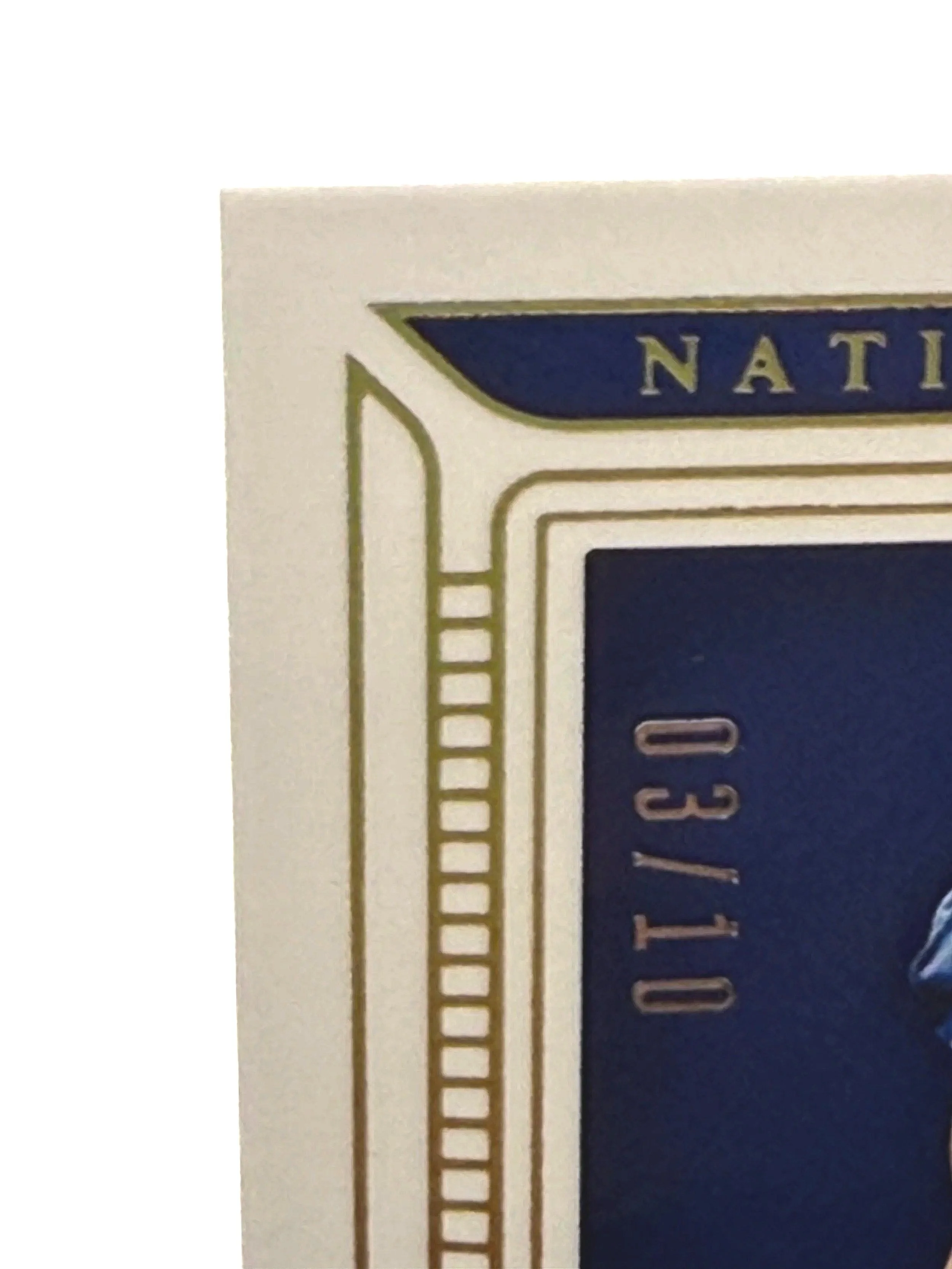 Top left corner close-up of 2025 National Treasures Abdul Carter Century Materials /10 rookie patch card showing edge and corner condition & serial numbering