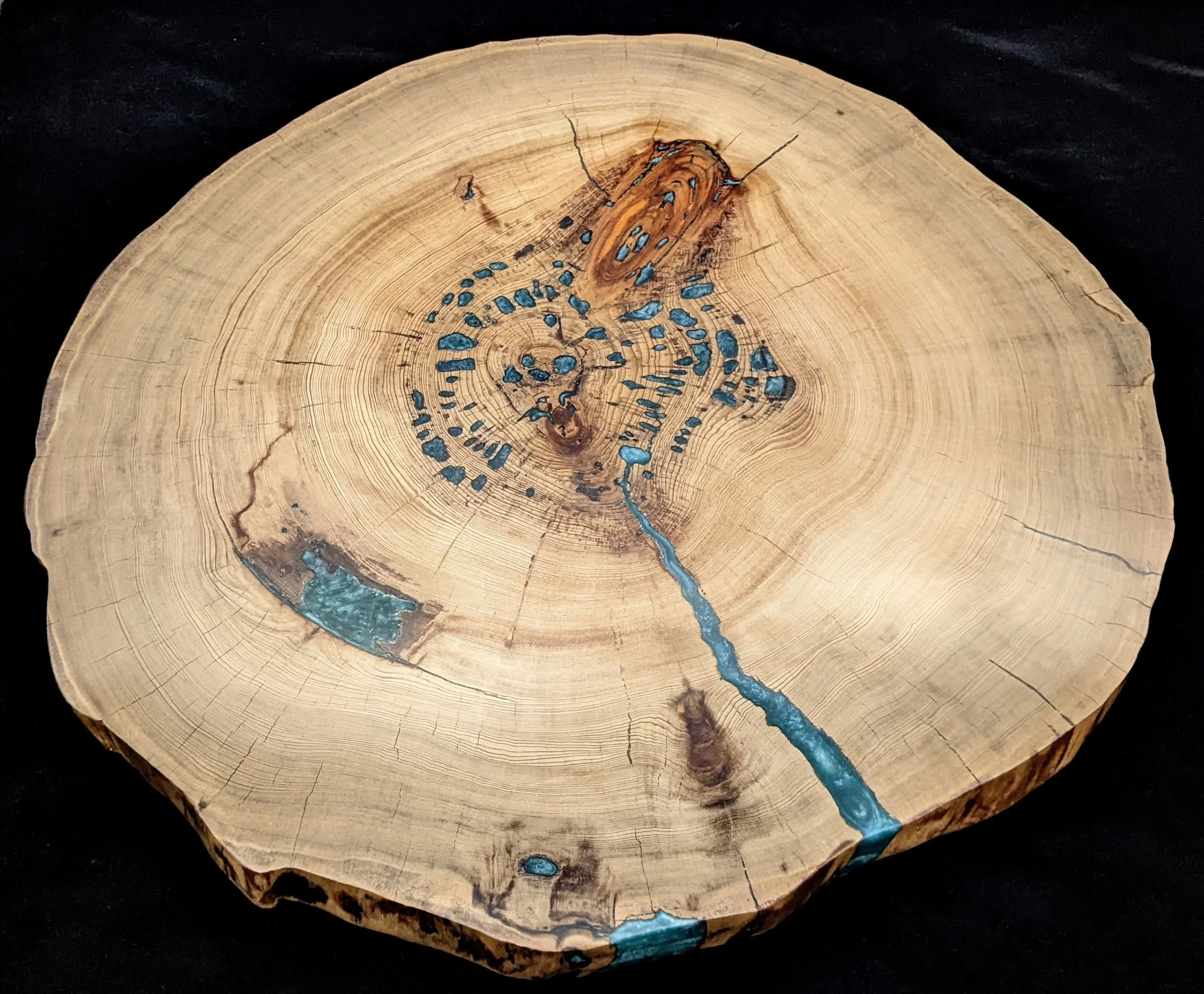 Maple Live Edge Epoxy Table Top by Art Illusions by Young, Folsom, Louisiana. Sold. Natural maple slab with dramatic turquoise-blue epoxy river flowing through a central crack and knot, creating luminous depth and organic beauty.