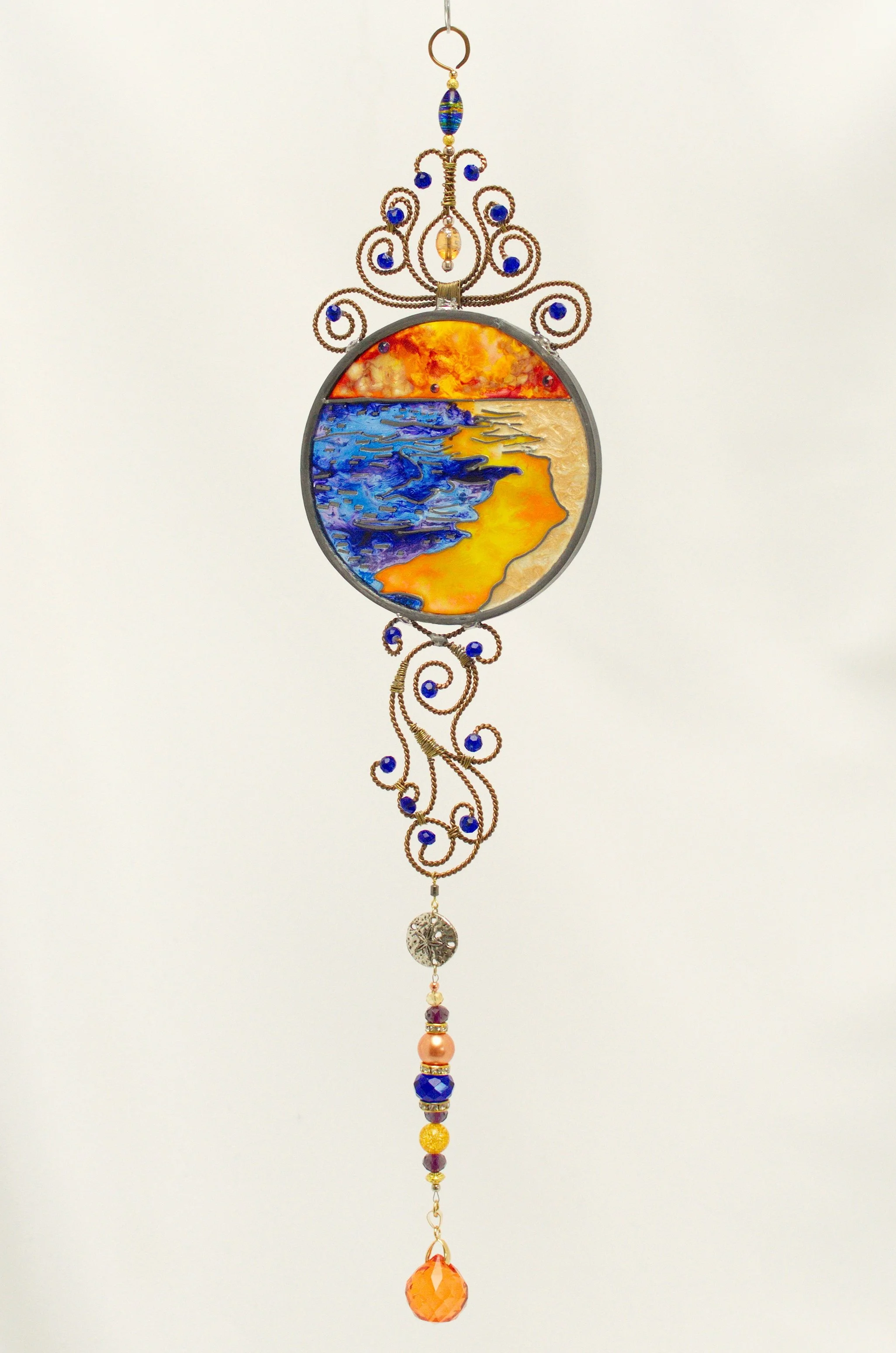 🔴 Sold: 
Rolling Tide Illusion Glass by Art Illusions by Young. Crashing ocean waves and dynamic water movement fill this round suncatcher with shades of deep blue and white foam. The energetic composition evokes the power and beauty of the sea.
