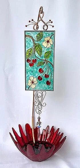 Cherry Jubilee by Art Illusions by Young. A joyful celebration of summer’s bounty bursts with life in this hand-painted and leaded Illusion Glass panel. Clusters of ripe, glossy red cherries hang from delicate branches alongside soft white blossoms a