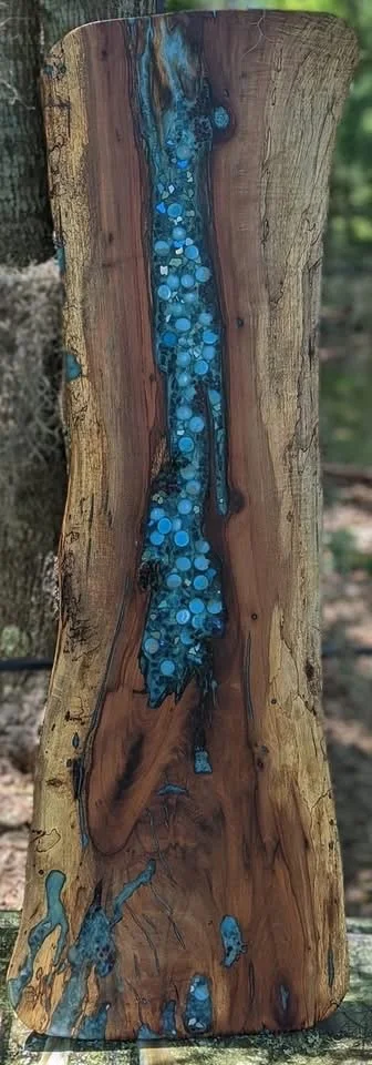 🔴 Sold:
Magnolia River Epoxy Table Top by Art Illusions by Young, Folsom, Louisiana. This commissioned striking live-edge table top features a magnificent slab of magnolia wood with a dramatic turquoise-blue epoxy river flowing through its natural g