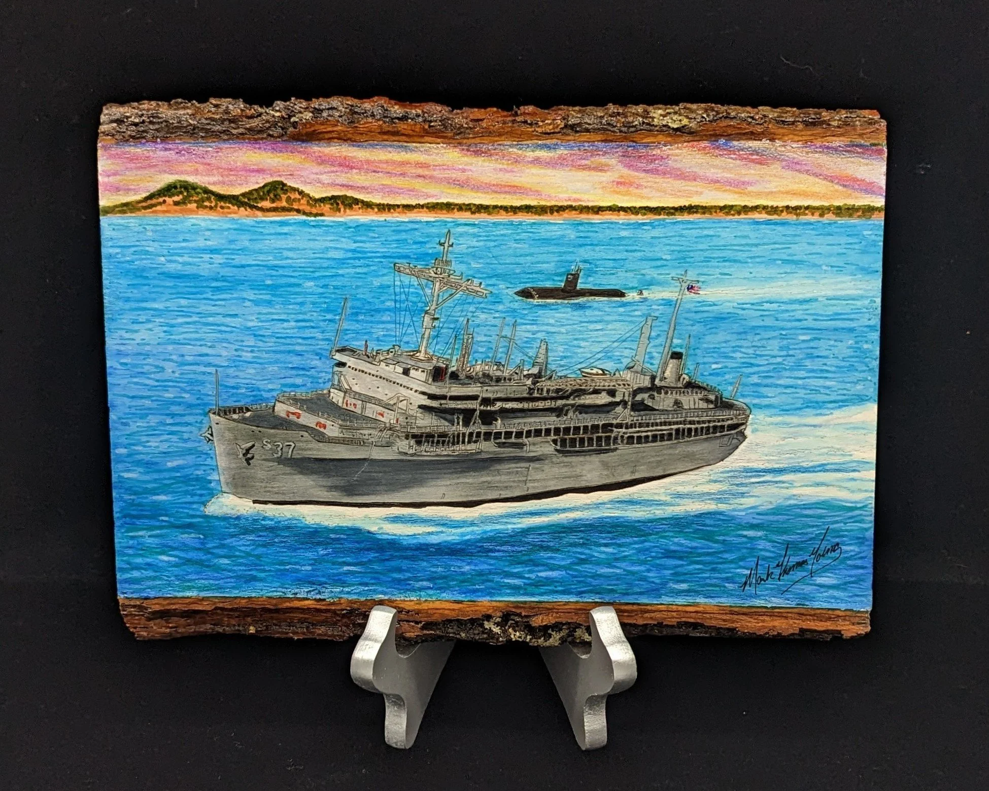 🔴 Sold:
USS Dixon AS-37 Underway with Submarine Escort Pyrography by Art Illusions by Young, Folsom, Louisiana. This dynamic woodburn captures the submarine tender USS Dixon (AS-37) underway in open blue waters, accompanied by a submarine escort on 