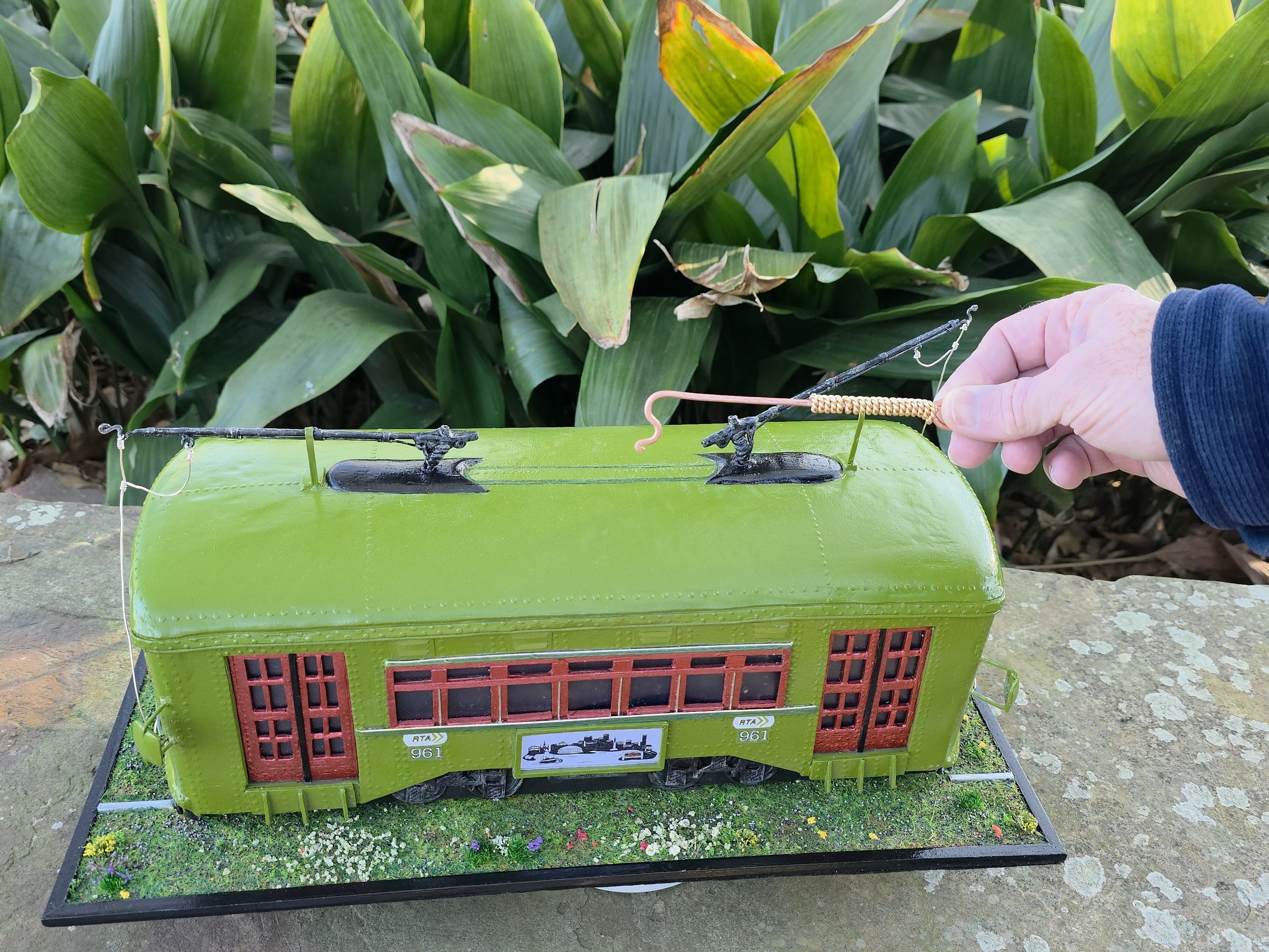Top view of the New Orleans streetcar tissue box cover showing the roof design and functional tissue dispensing area. Hand-sculpted mixed media diorama by Art Illusions by Young in Folsom, Louisiana.