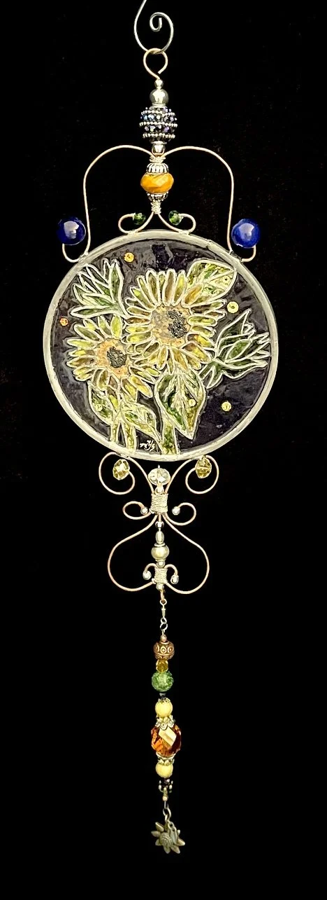 🔴 Sold: 
Daisies Illusion Glass by Art Illusions by Young. Another fresh bouquet of daisies blooms in this bright circular suncatcher, with soft petals and green foliage glowing against a light background. The simple, joyful design brings natural el