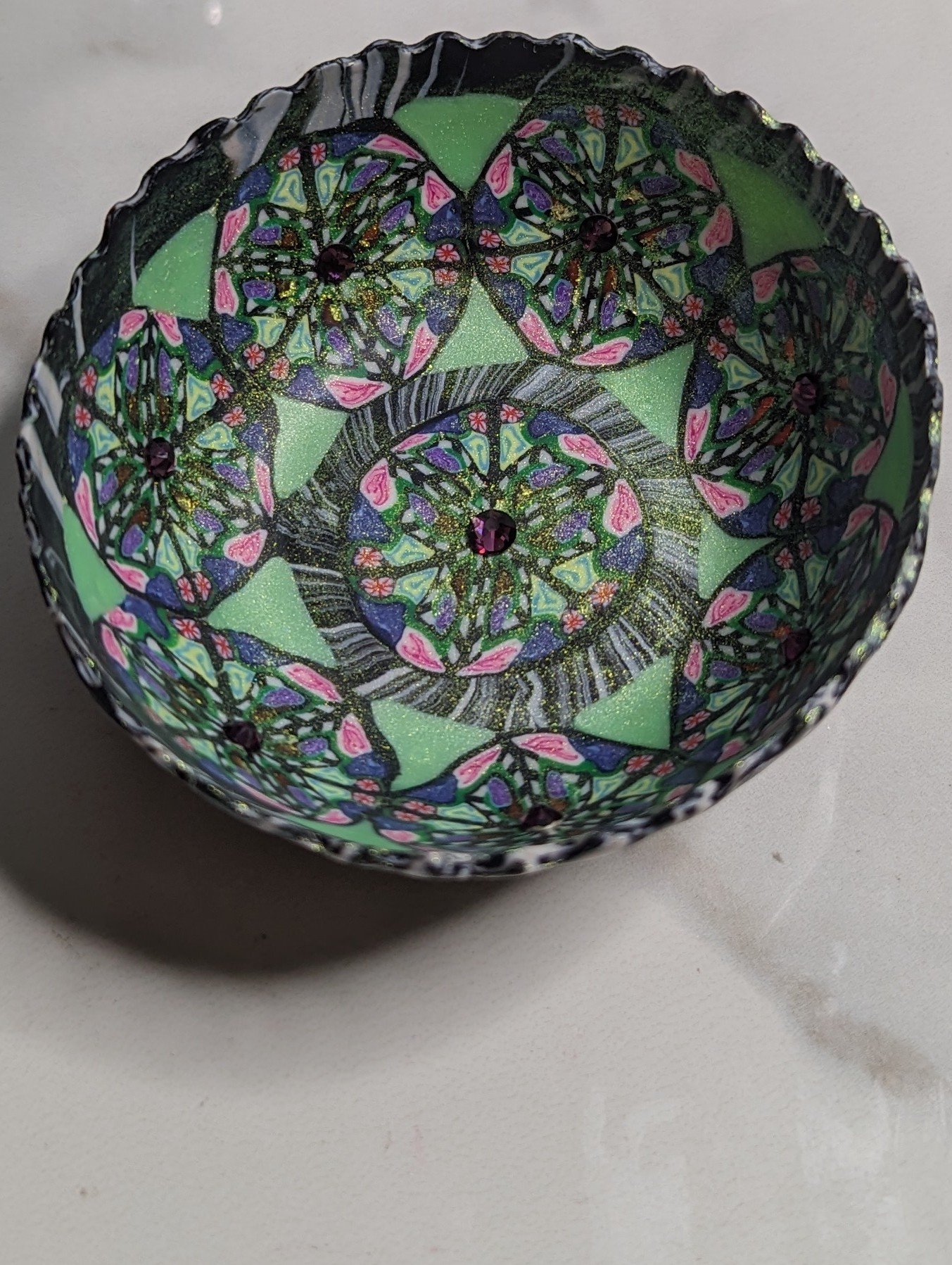 🔴 Sold: 
Polymer Clay Trinket Bowl by Art Illusions by Young. This ornate bowl is covered in intricate hand-sculpted polymer clay with green, pink, and black patterns resembling stained glass or lace. The complex surface texture and vibrant colors m
