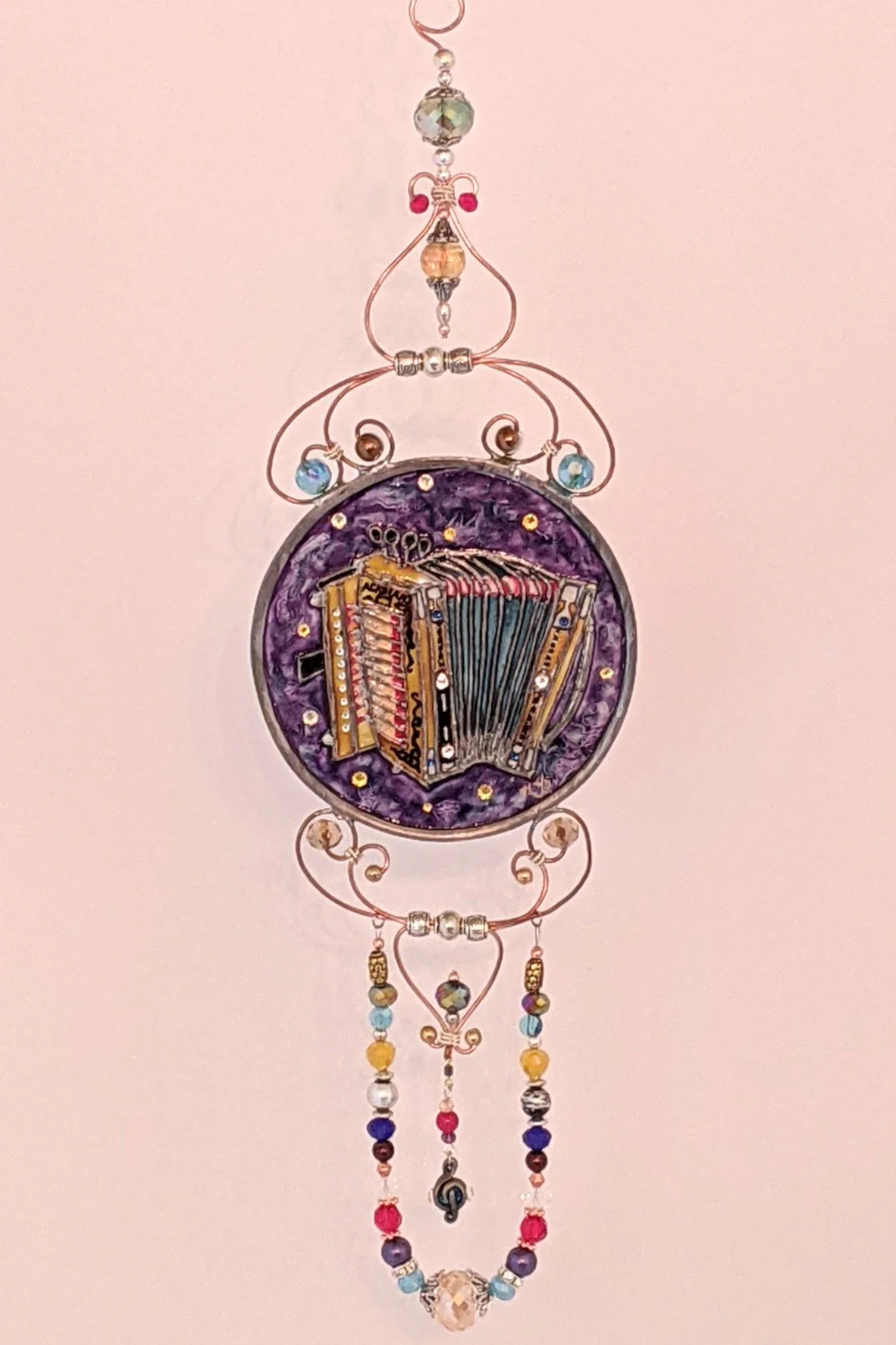 🔴 Sold: 
Zydeco Cajun Accordion Illusion Glass by Art Illusions by Young. This lively circular suncatcher features a traditional Zydeco accordion with rich wood tones and musical accents, evoking the energetic rhythms of Louisiana Cajun and Creole m