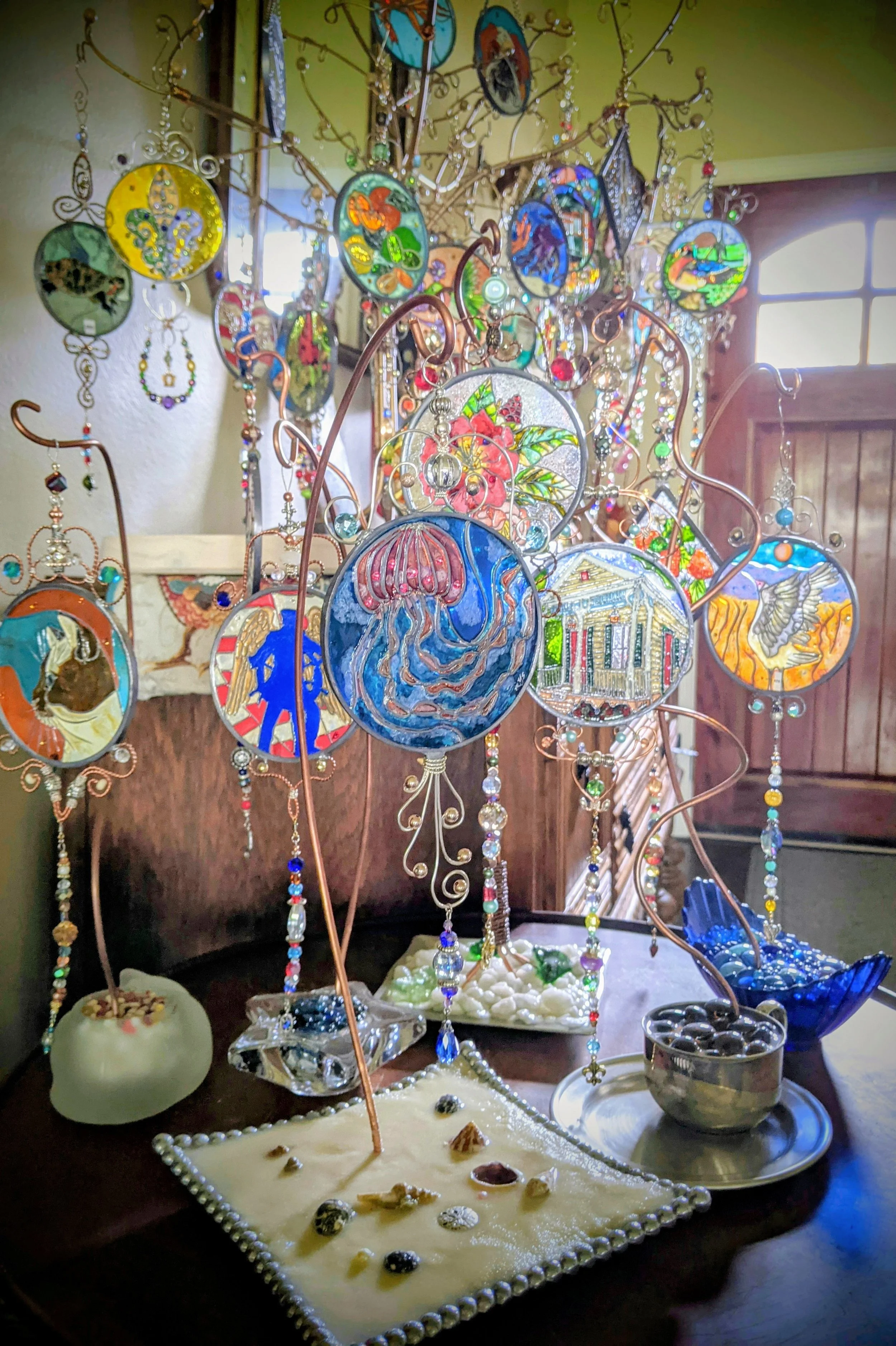 
Collection of Handcrafted Display Stands Showcasing Illusion Glass
A beautiful assortment of our custom display stands, each uniquely designed to elevate and complement Illusion Glass pieces. From delicate copper wire structures with vintage bases t