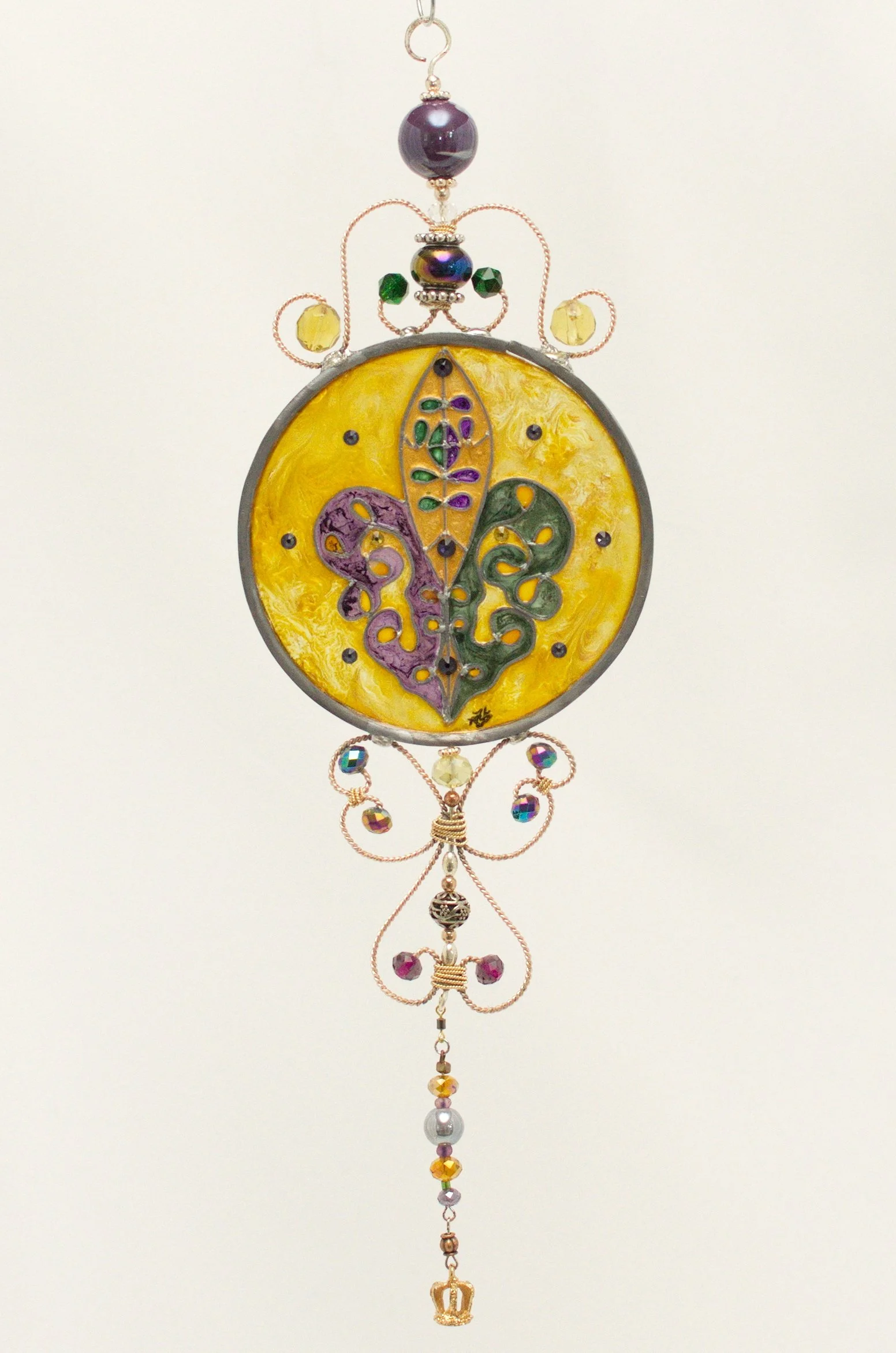 🔴 Sold: 
Fleur-de-Lis Illusion Glass by Art Illusions by Young. An elegant circular suncatcher centered on the iconic Louisiana fleur-de-lis in rich gold and purple tones with delicate beadwork. The piece proudly celebrates Crescent City heritage wi