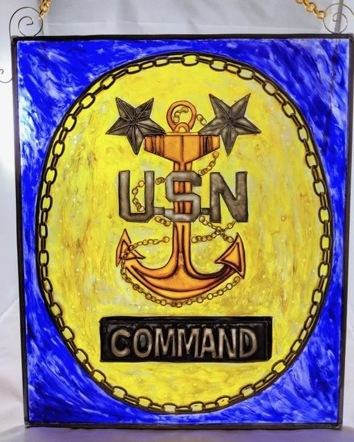 🔴 Sold: 
Command Master Chief Illusion Glass by Art Illusions by Young. This striking rectangular suncatcher honors the rank of Command Master Chief with the fouled anchor, stars, and bold “COMMAND” lettering against a vibrant yellow and blue backgr