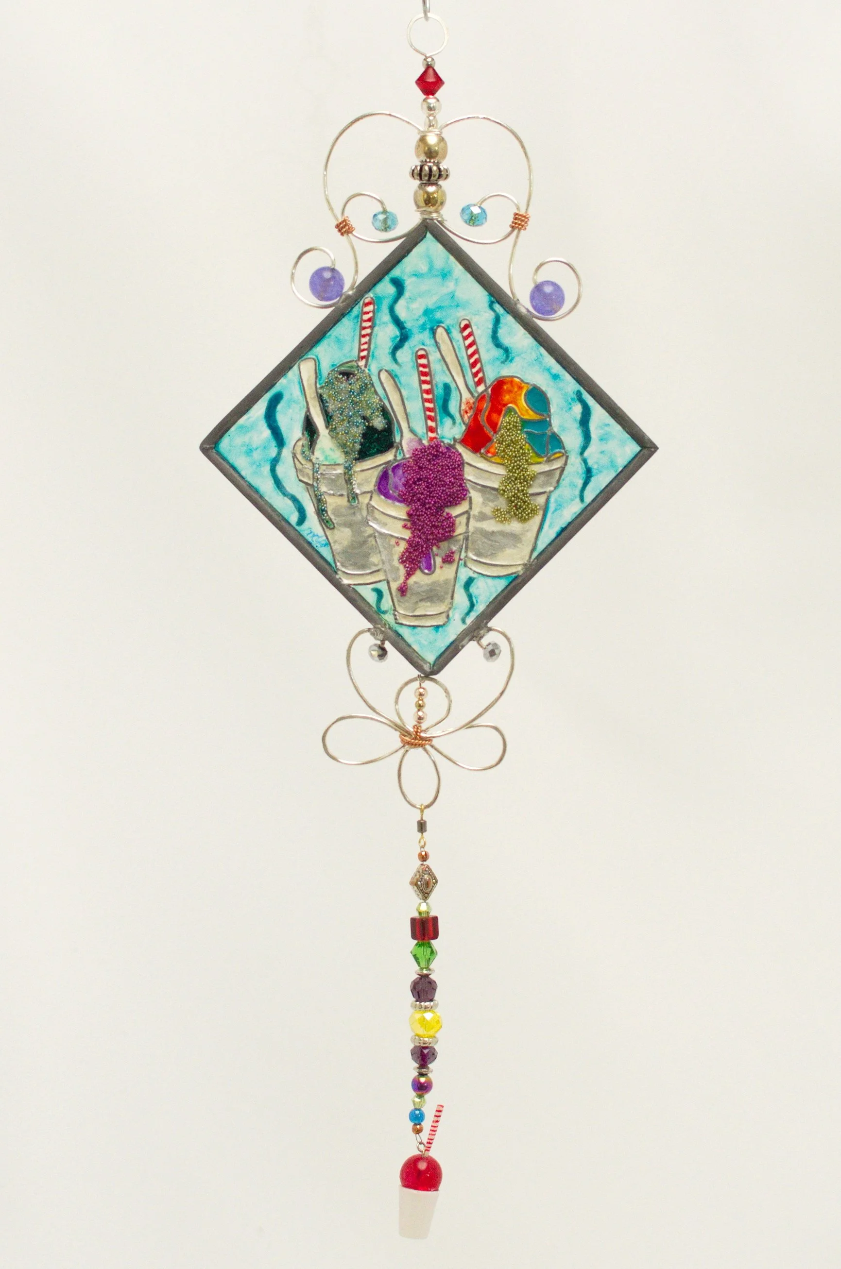 🔴 Sold: 
New Orleans Snowballs Illusion Glass by Art Illusions by Young. A cheerful diagonal suncatcher celebrating classic New Orleans snowballs with colorful syrups and the nostalgic snowball stand. Vibrant hand-painted details bring sweet summer 