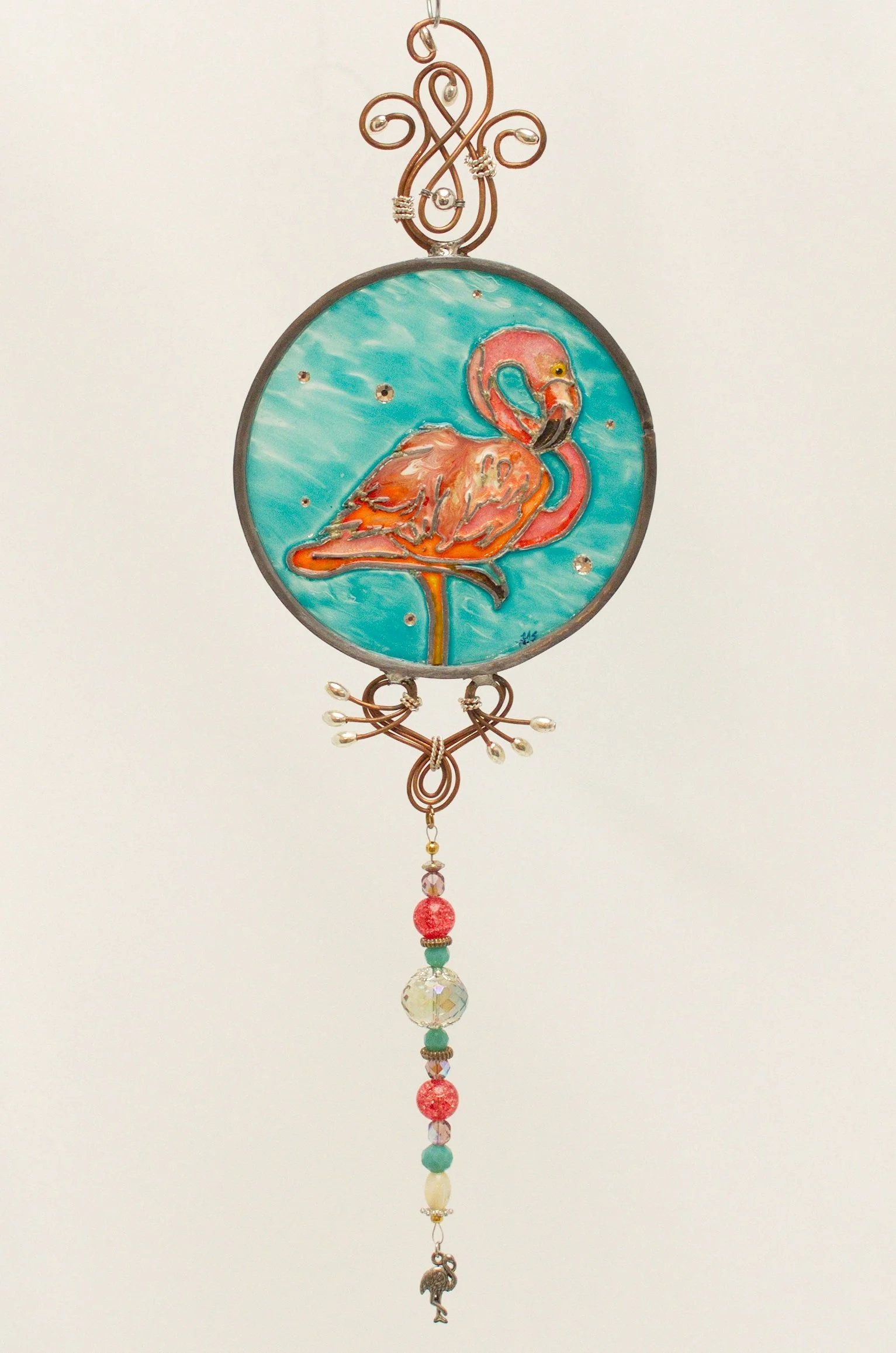 🔴 Sold: 
Flamingo at Sunset Illusion Glass by Art Illusions by Young. A tall flamingo stands elegantly against colorful turquoise in this round suncatcher. Soft pinks, oranges, and deep blues in hand-painted glass create a serene yet vibrant tropica