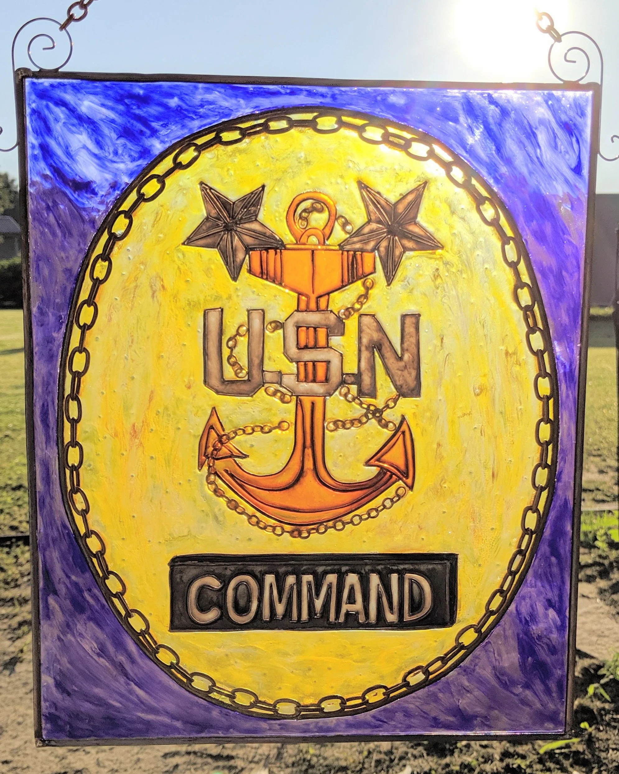 🔴 Sold: 
Command Master Chief Illusion Glass by Art Illusions by Young. This striking circular suncatcher honors the rank of Command Master Chief with the distinctive fouled anchor and stars against a bold yellow and cobalt background. A meaningful 
