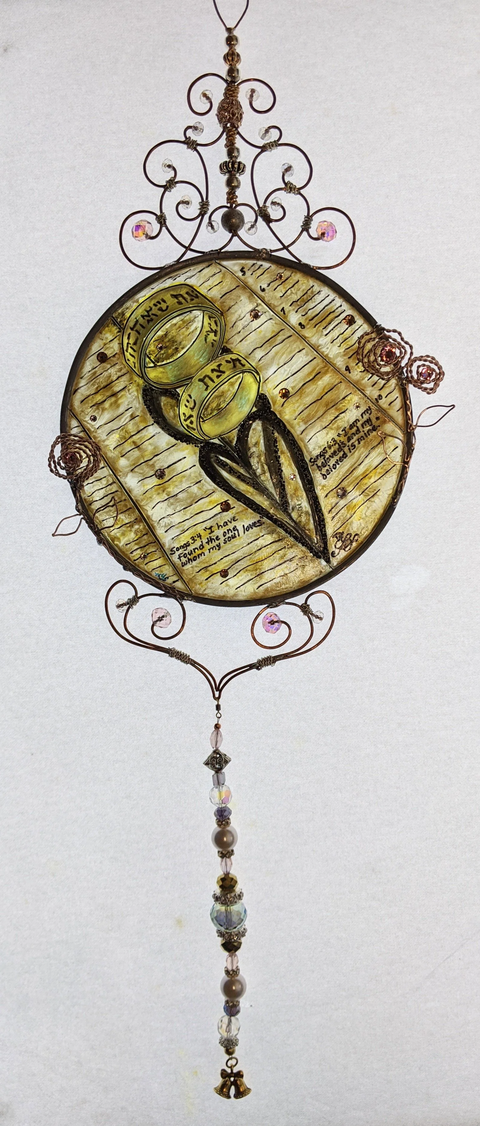 🔴 Sold: 
Hebrew Marriage Rings Illusion Glass by Art Illusions by Young. An elegant round suncatcher commemorating a marriage proposal with symbolic elements and rich, meaningful colors. The piece blends cultural significance with luminous painted g