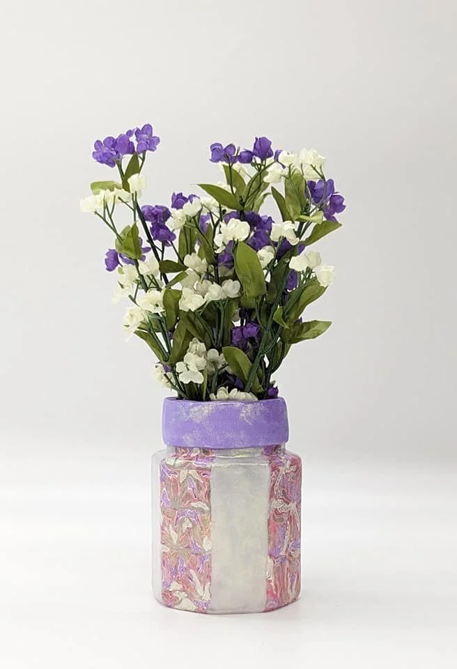 🔴 Sold: 
Lavender Polymer Clay Jar by Art Illusions by Young. This elegant jar is covered in hand-sculpted lavender, pink and white polymer clay with delicate floral and decorative accents. The soft color and intricate texture create a sophisticated