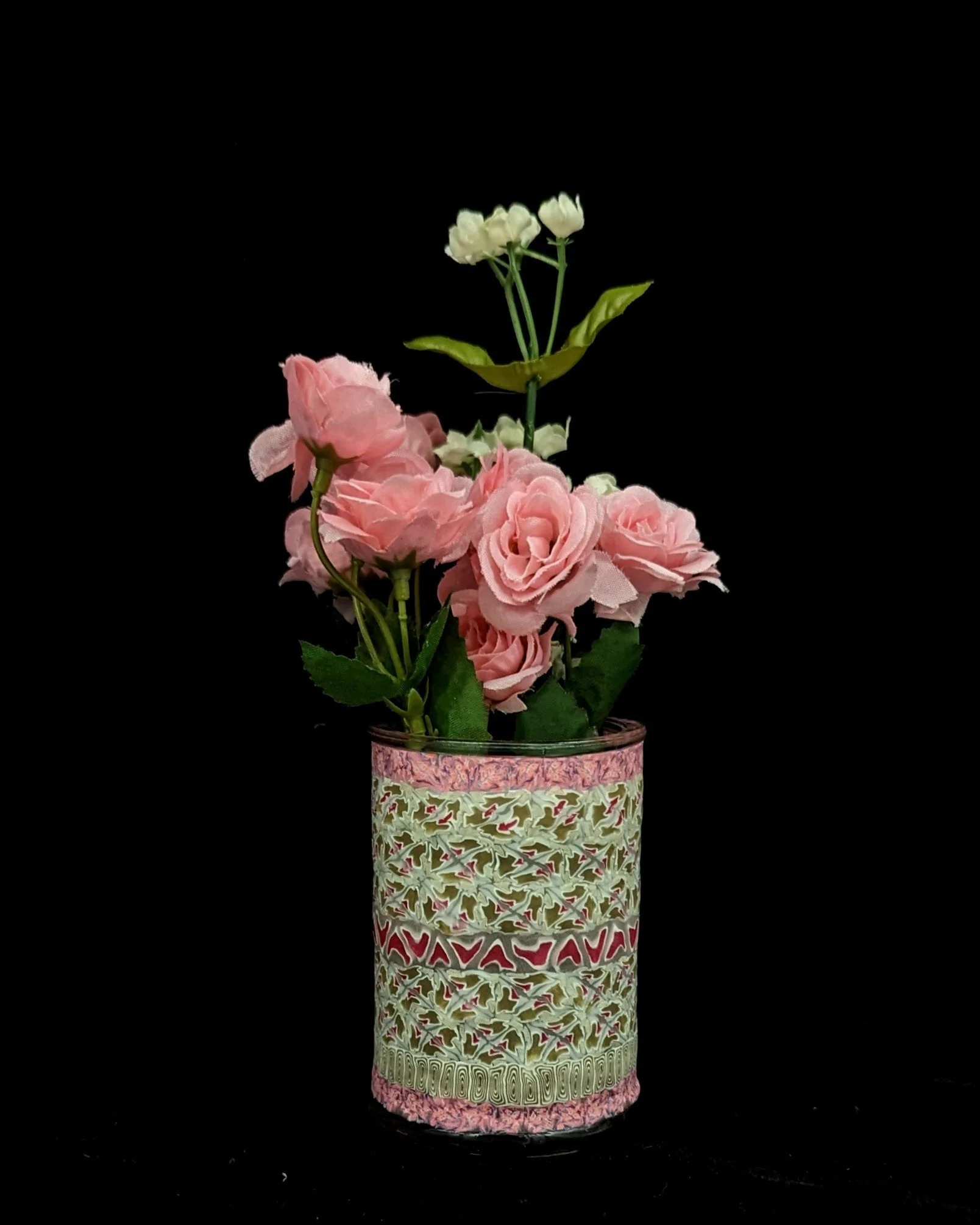 Floral Lace Trinket Jar by Art Illusions by Young displayed with a small bouquet of pink flowers. The delicate lace-like pattern and soft cream base with pink and gold accents create a charming vignette that celebrates the beauty of handcrafted detai
