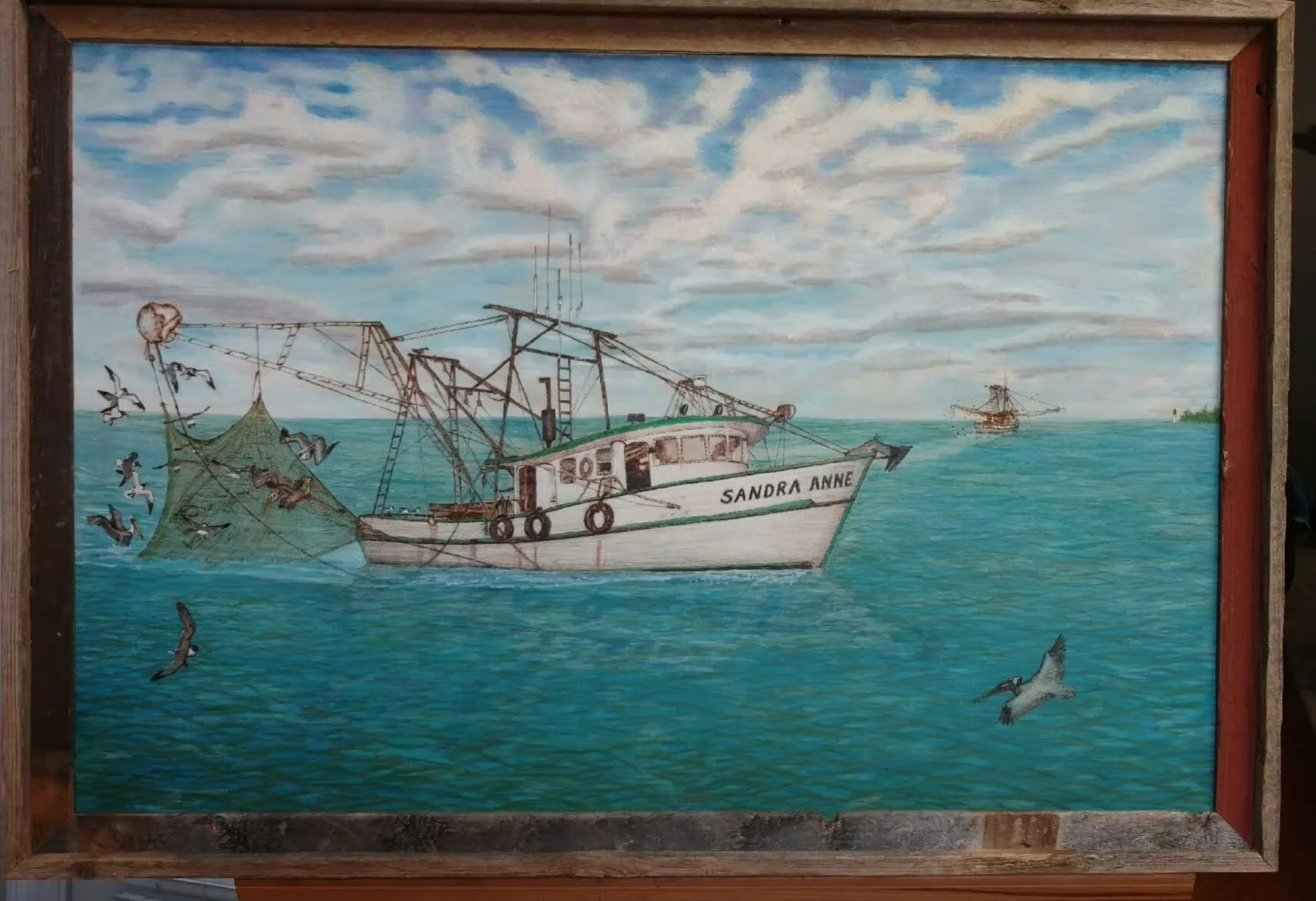 Original woodburned and hand-colored shrimp boat scene by Art Illusions by Young from Folsom, Louisiana. A classic white shrimp boat floats calmly on turquoise Lake Pontchartrain waters under a soft, cloudy sky, with hungry pelicans soaring nearby. M