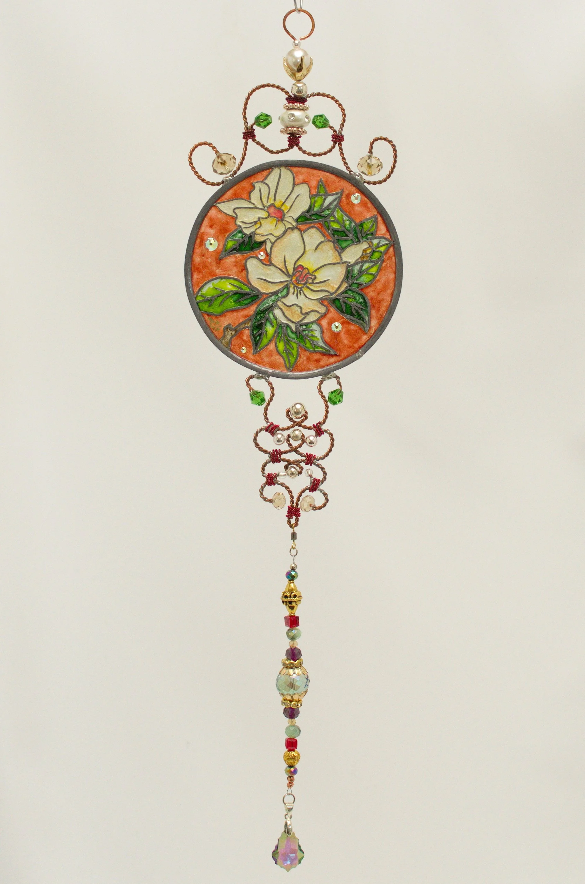 🔴 Sold: 
Magnolias Illusion Glass by Art Illusions by Young. Another elegant depiction of creamy magnolia blossoms and foliage in this round suncatcher. The soft, luminous painting celebrates the timeless beauty of Southern flora.