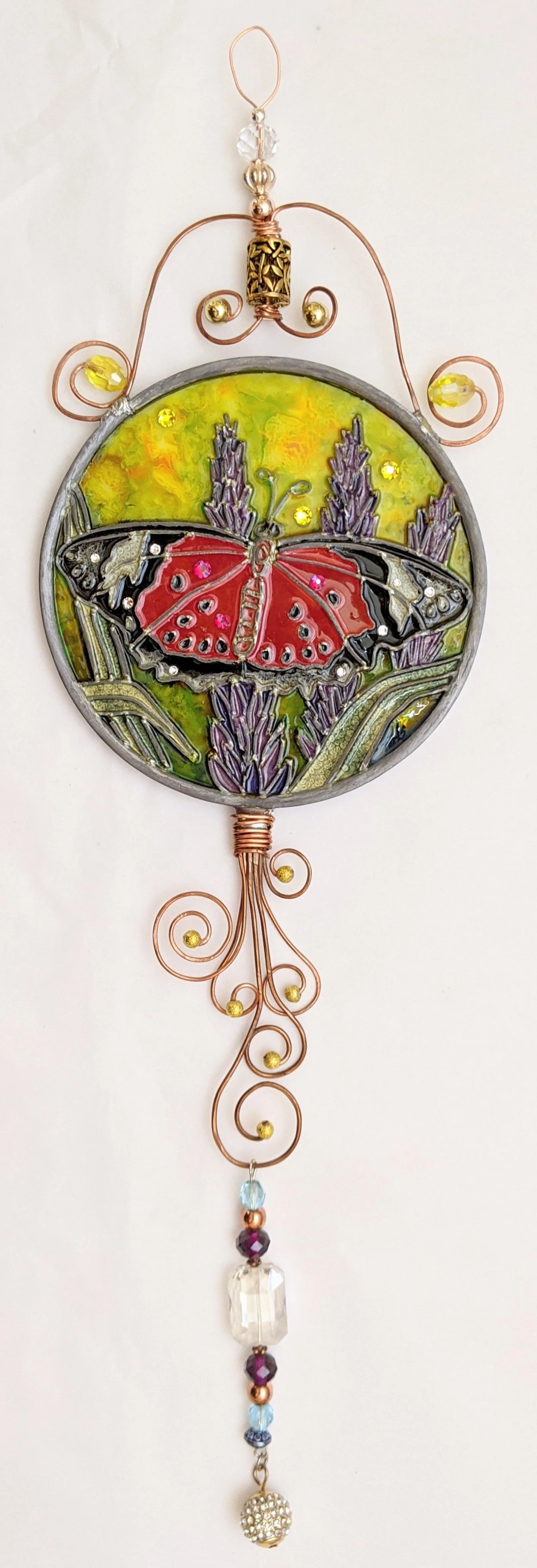 🔴 Sold: 
Red Butterfly with Black Tips Illusion Glass by Art Illusions by Young. This dramatic circular suncatcher displays a bold red butterfly with distinctive black wing tips and intricate patterns. The vibrant contrast and hand-painted details m