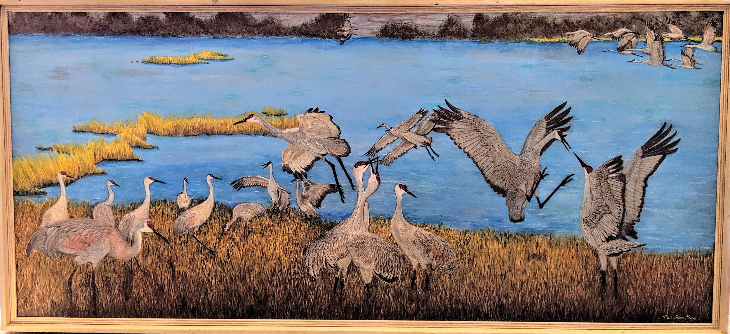 🔵Donated:  Sandhill Crane Museum
Sandhill Crane Migration on Platte River woodburn by Art Illusions by Young, Folsom, Louisiana. A detailed pyrography scene on wood captures a flock of majestic sandhill cranes gathered in golden marsh grasses agains