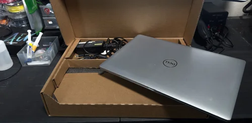 A laptop packed in the Hypnotik shipping box, ready to mail in