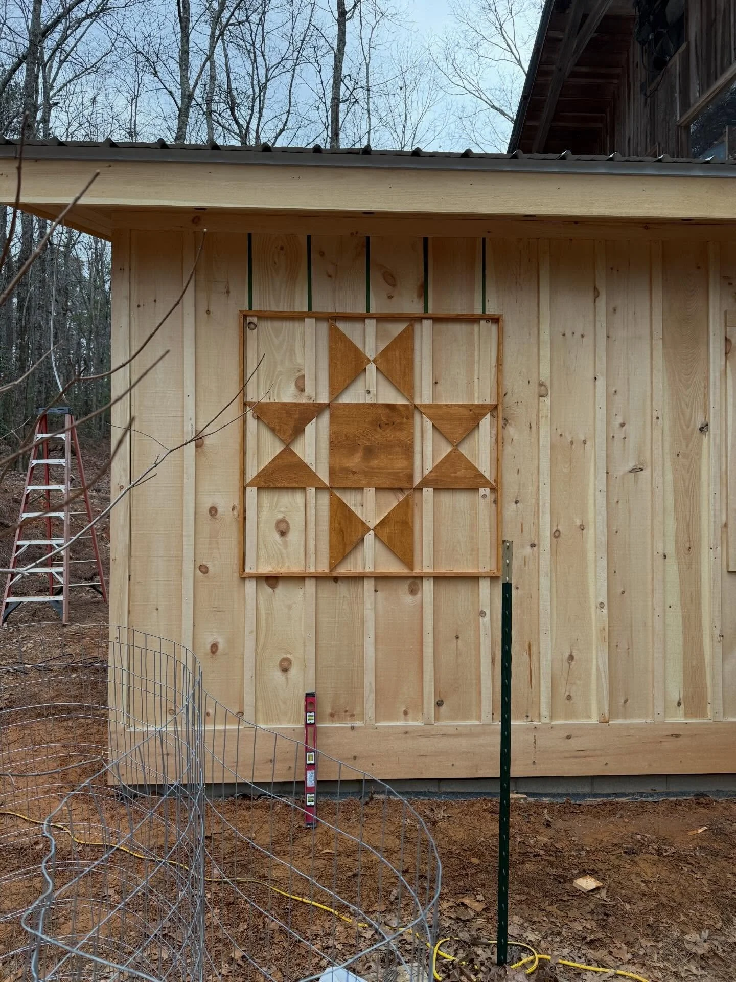 Exterior all trimmed out and a fun quilt square for a bit of home state pride. Any guesses on this quilt square pattern?