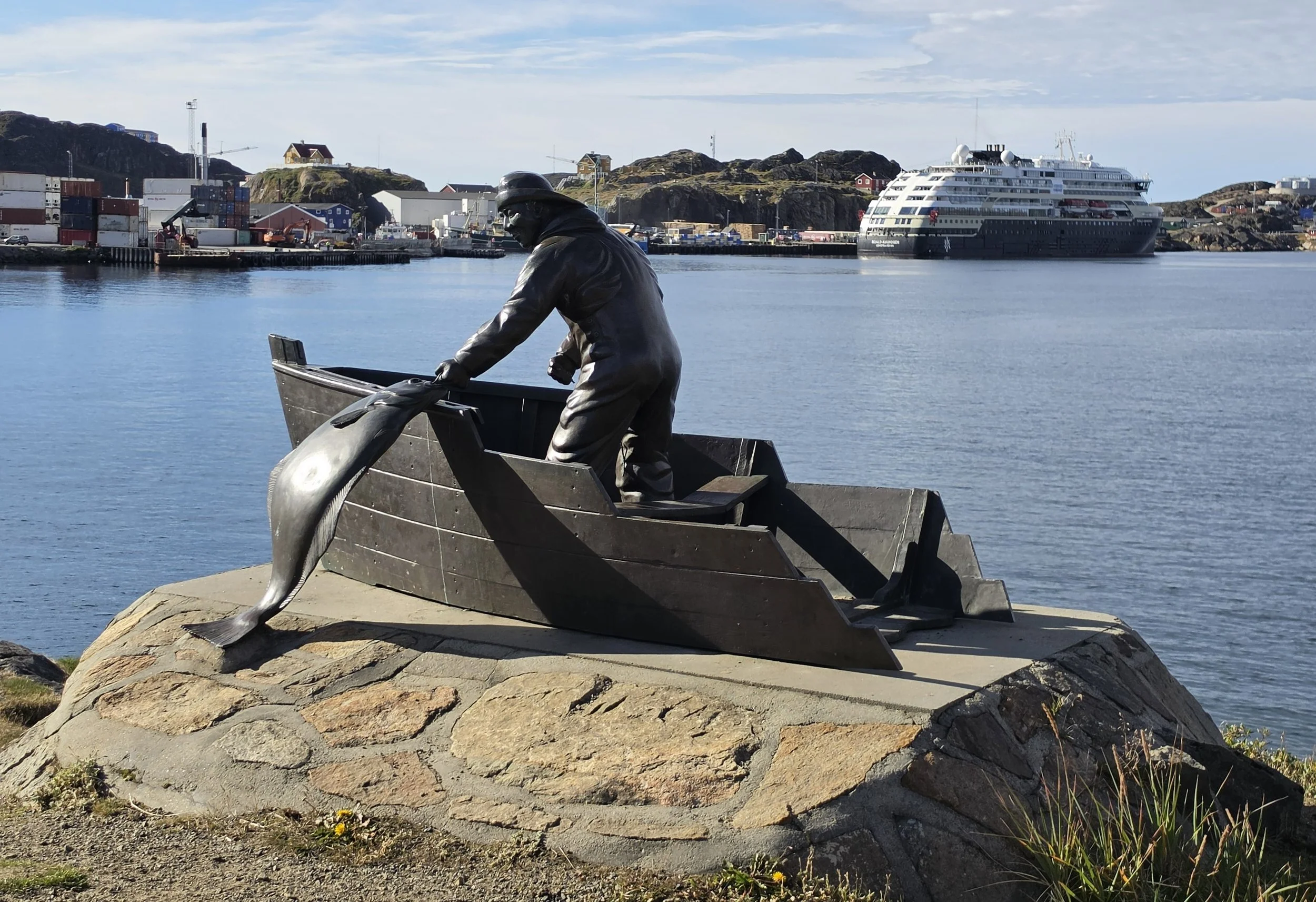 2026-9-1 - Sismiut - Fisherman with halibut sculpture with ship in background.jpg